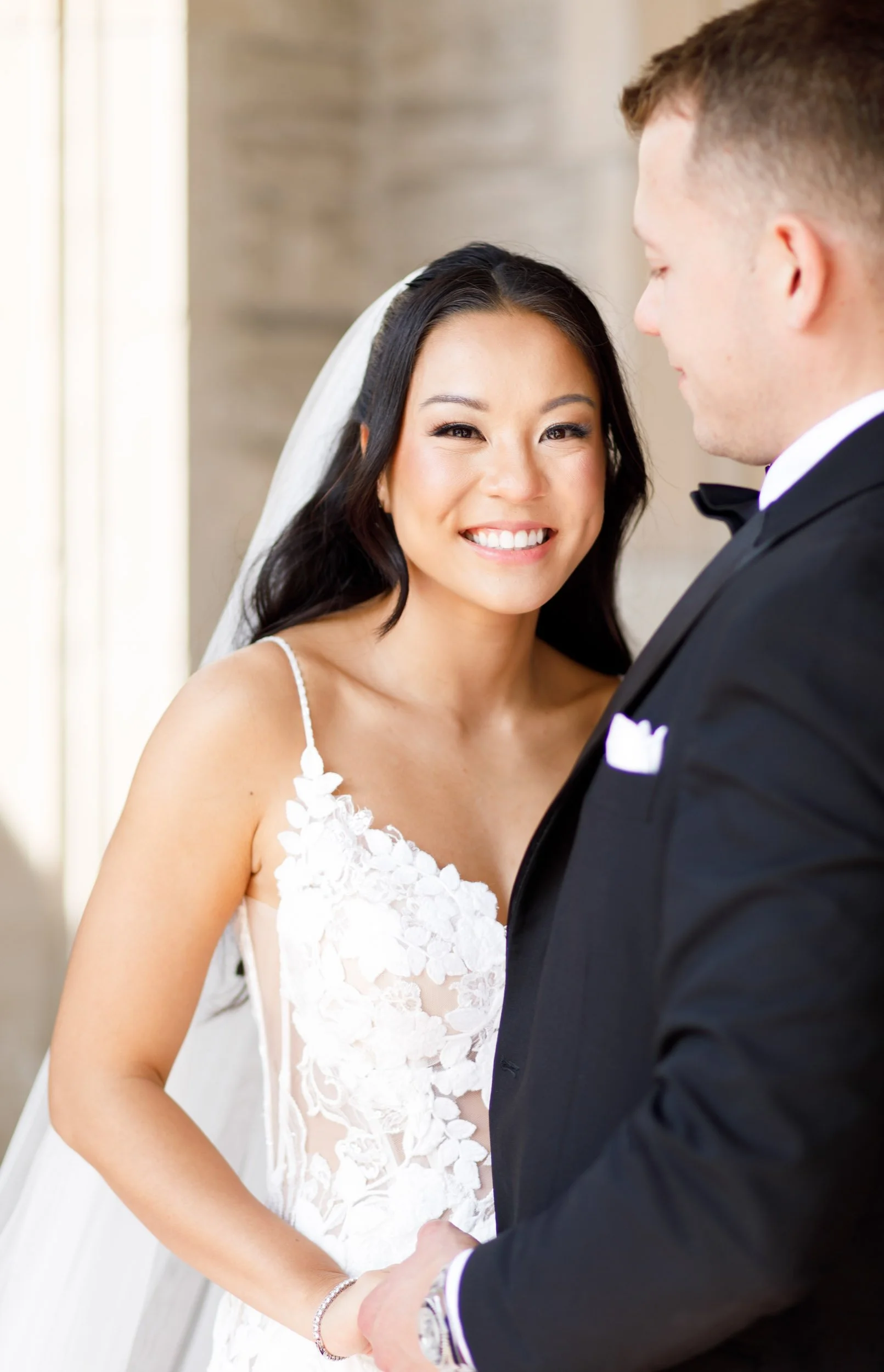 Bride smiling with the groom at Casa Loma in Toronto