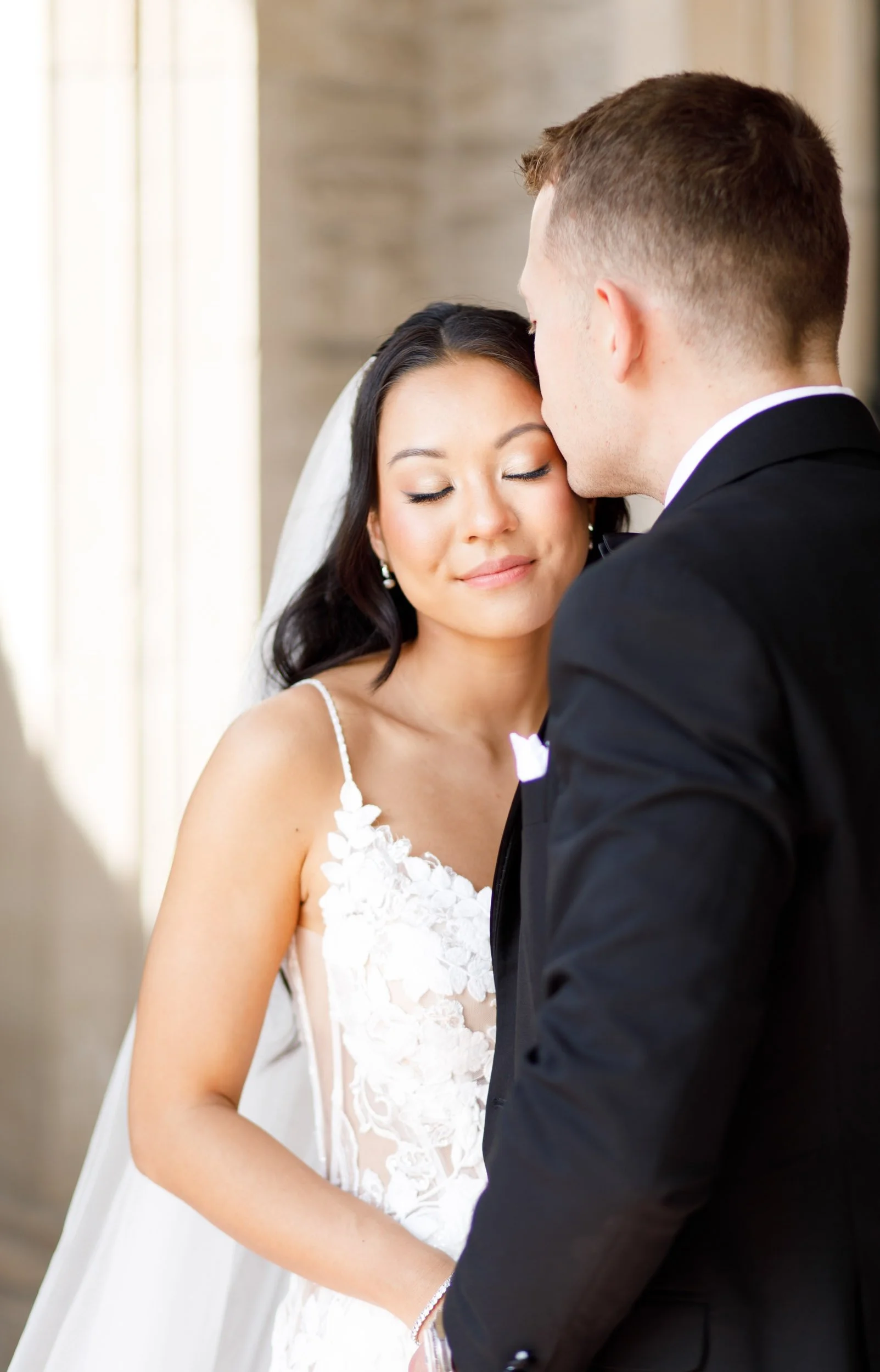 Bride resting her head on the groom at Casa Loma