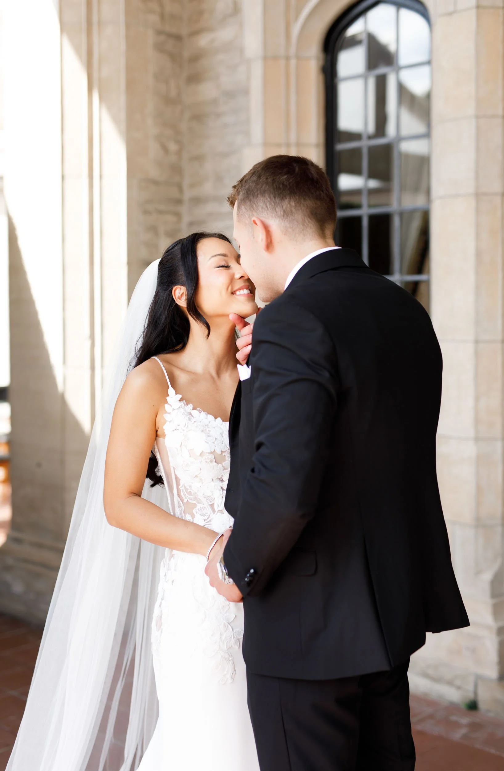Bride and groom sharing a kiss outside Casa Loma