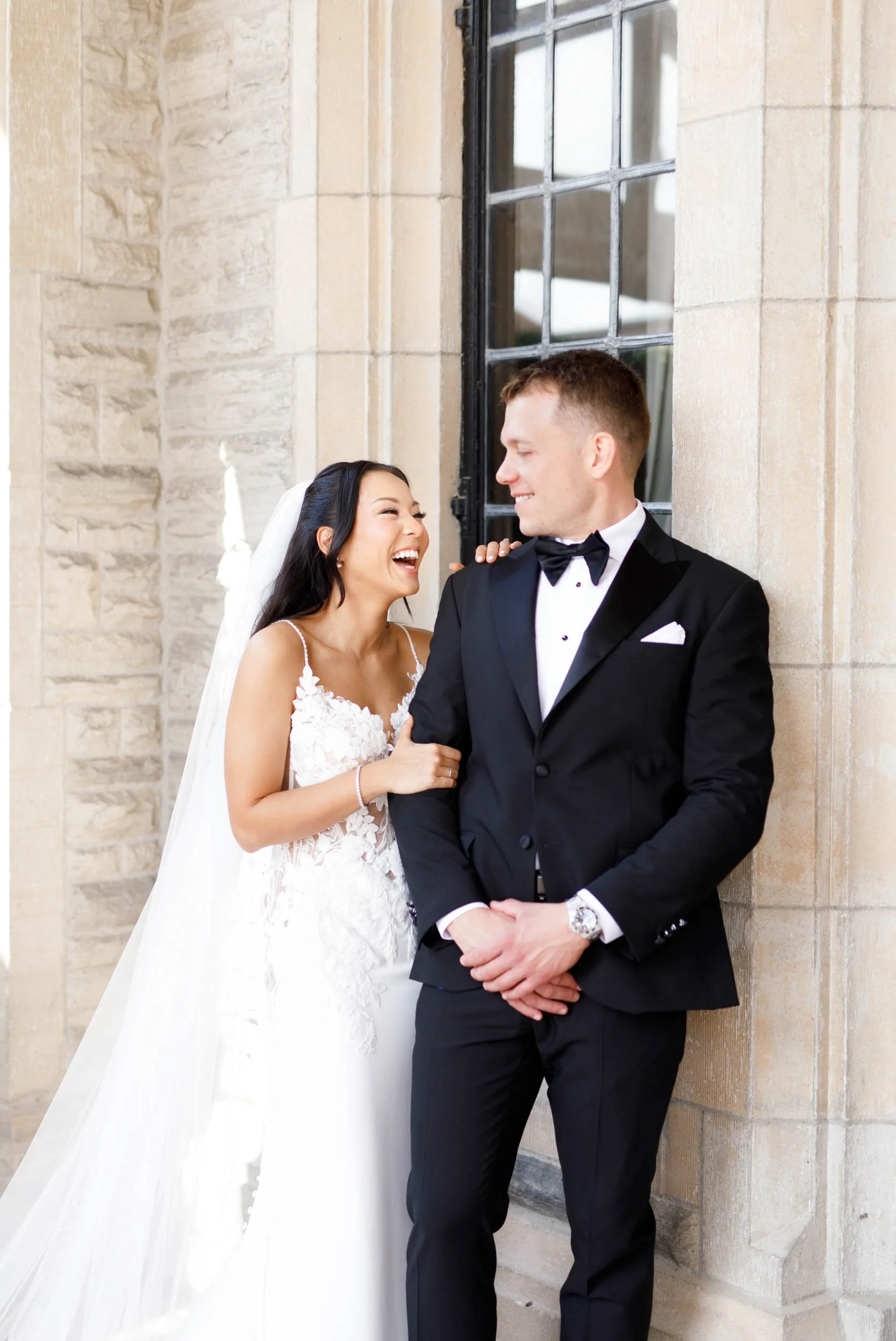 Bride and groom laughing outside Casa Loma