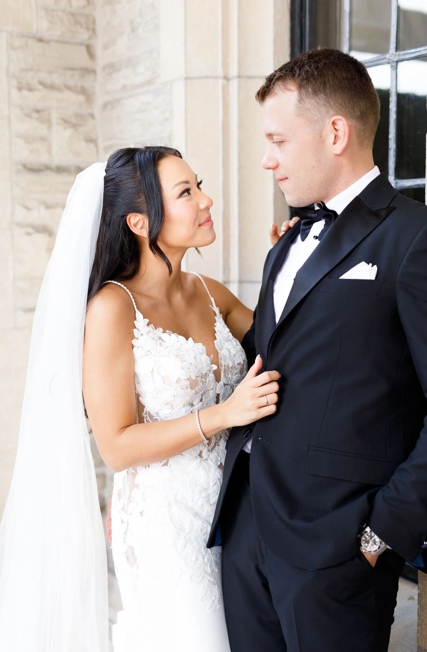 Bride and groom standing together outside Casa Loma