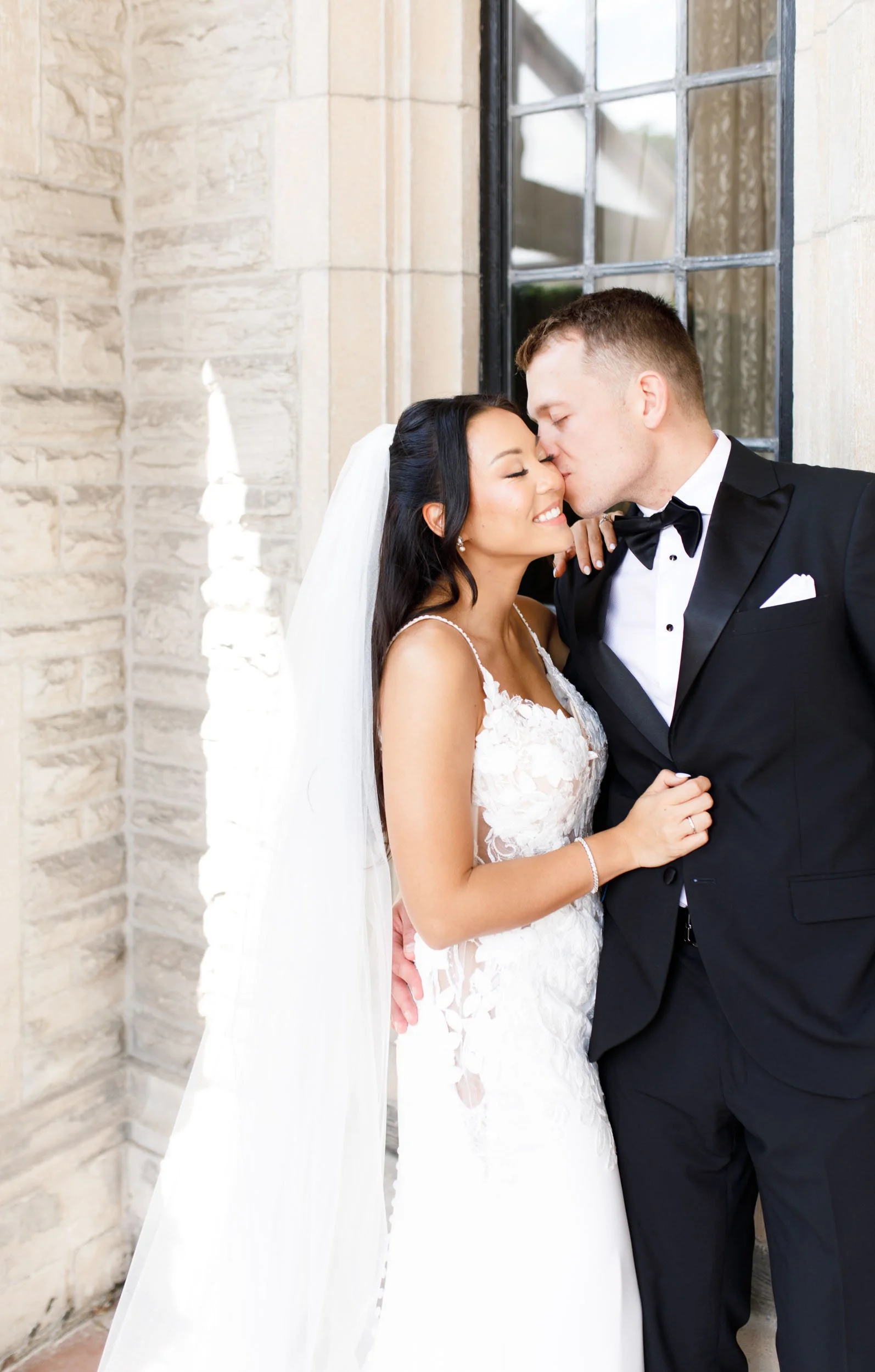 Bride and groom sharing a kiss at Casa Loma in Toronto