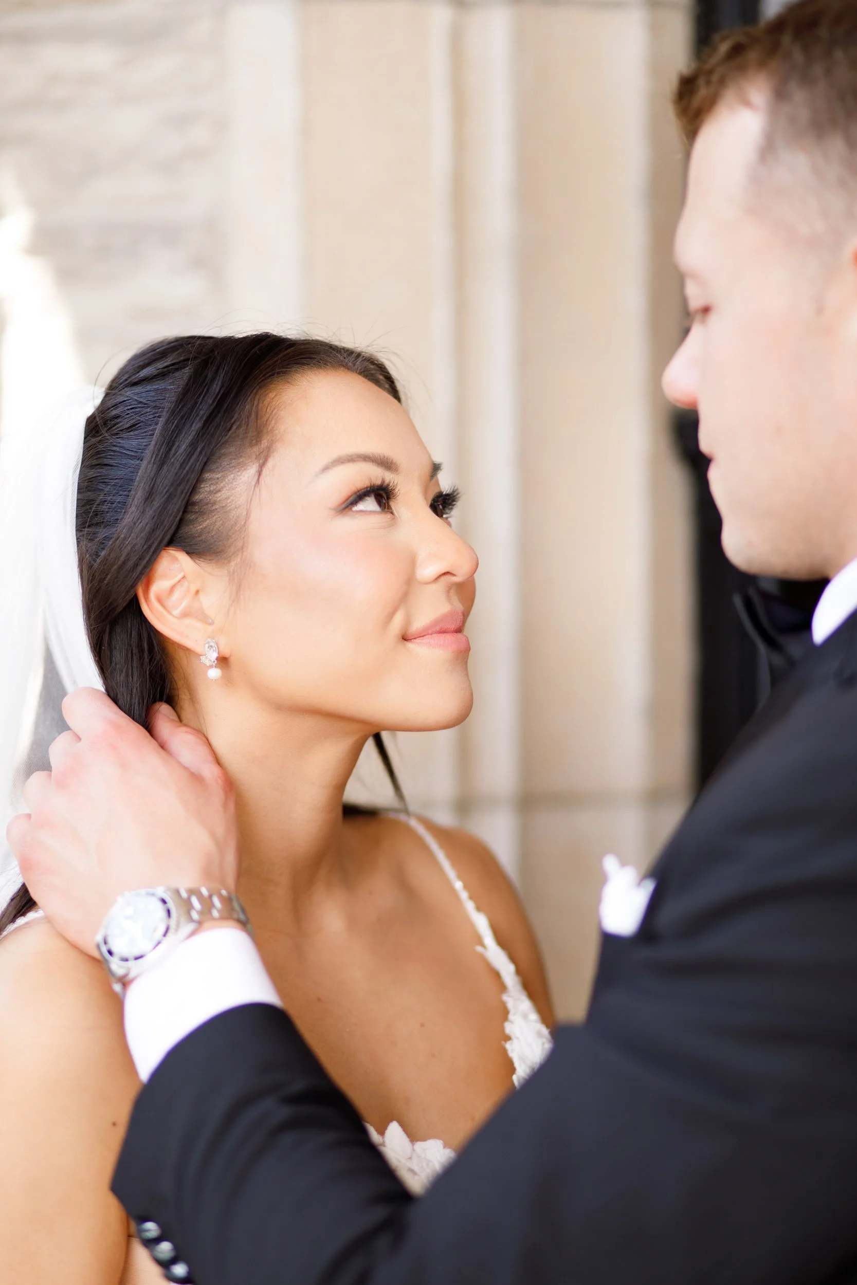 Bride and groom gazing at each other outside Casa Loma
