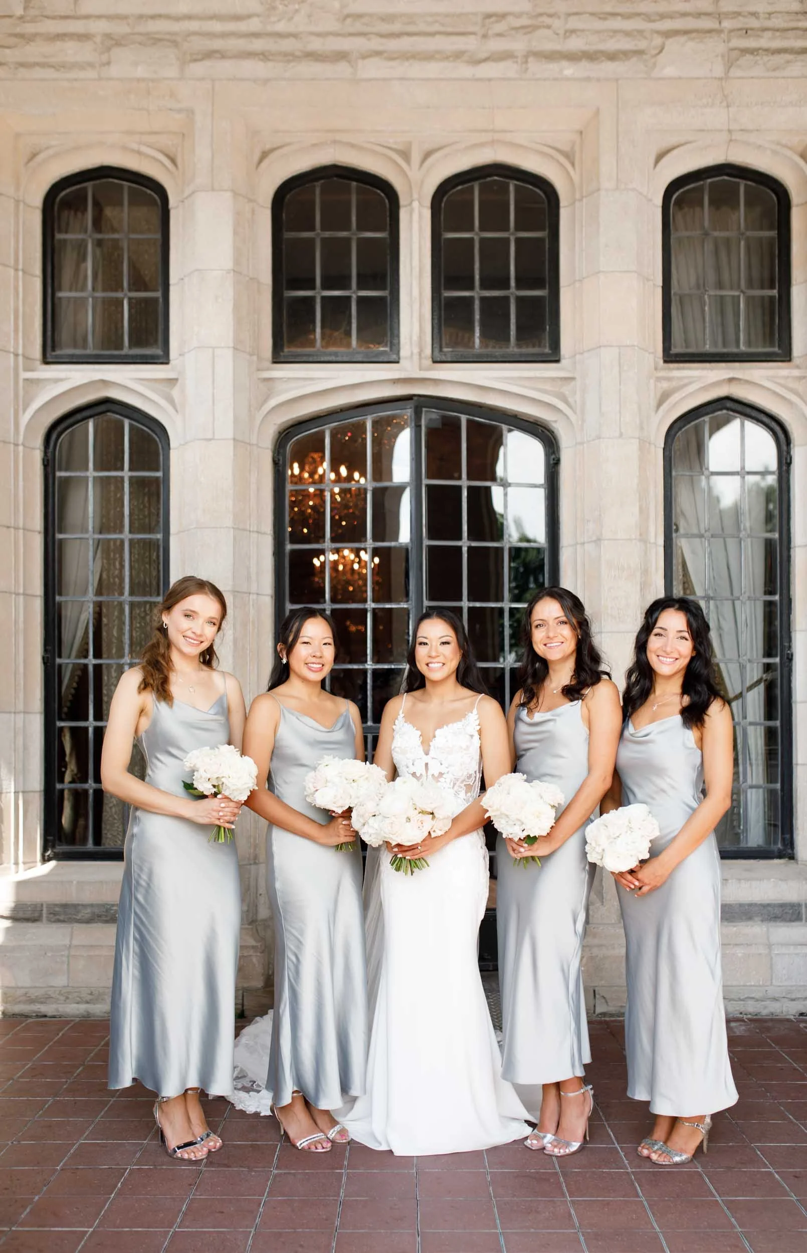 Bridal party in front of Casa Loma in Toronto
