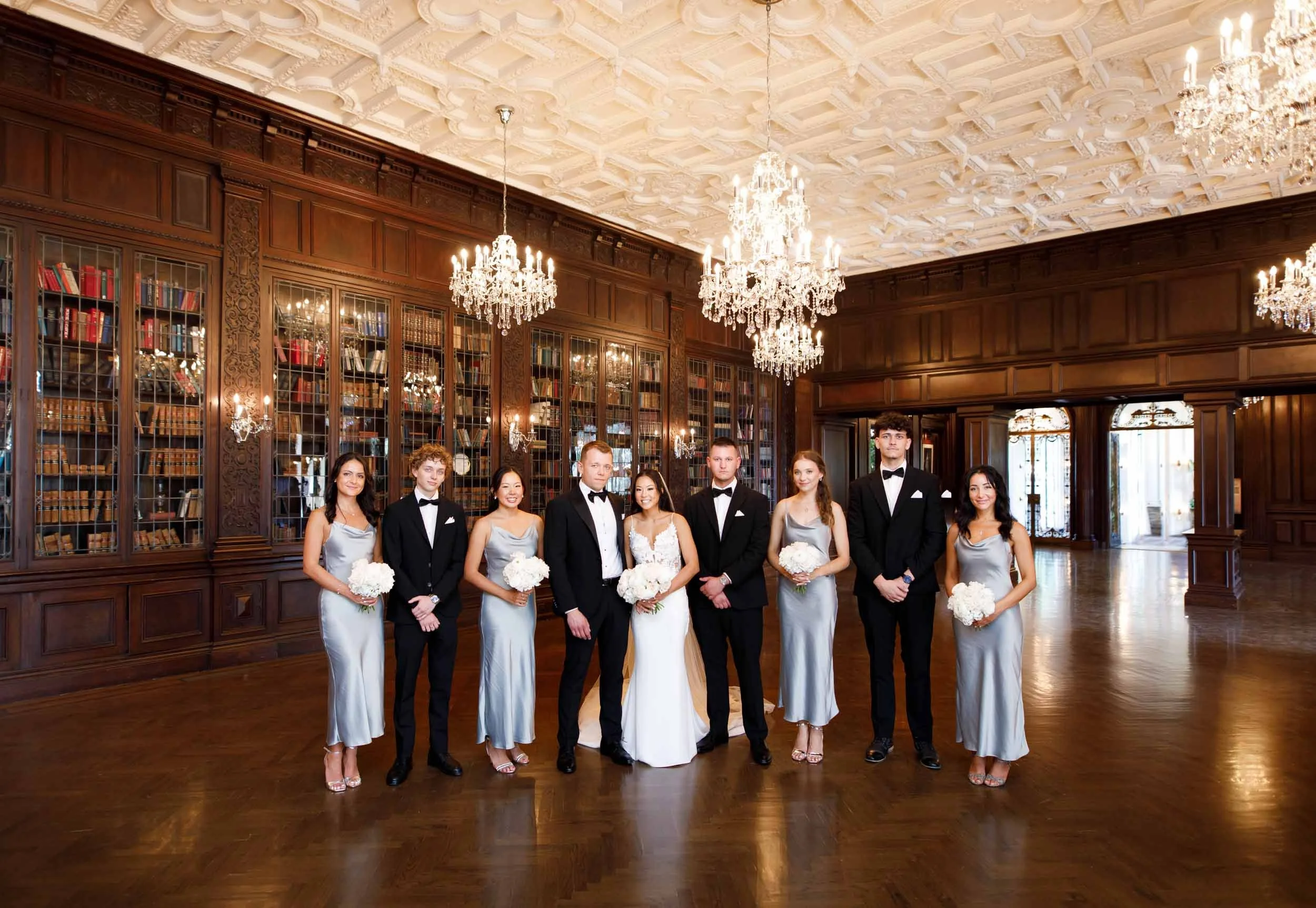 Wedding party inside Casa Loma Library in Toronto