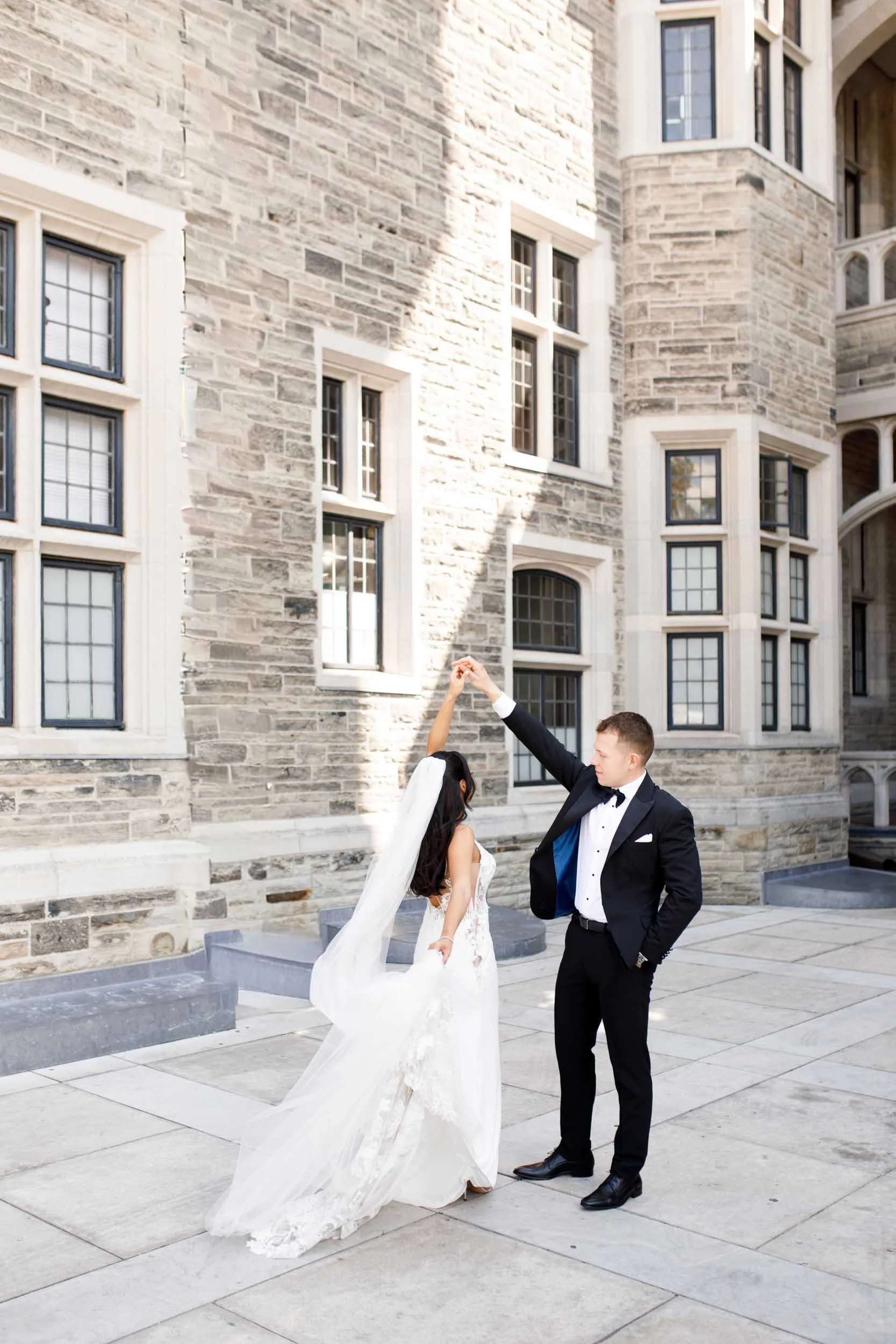 Bride spinning in her gown during a Casa Loma wedding portrait session in Toronto