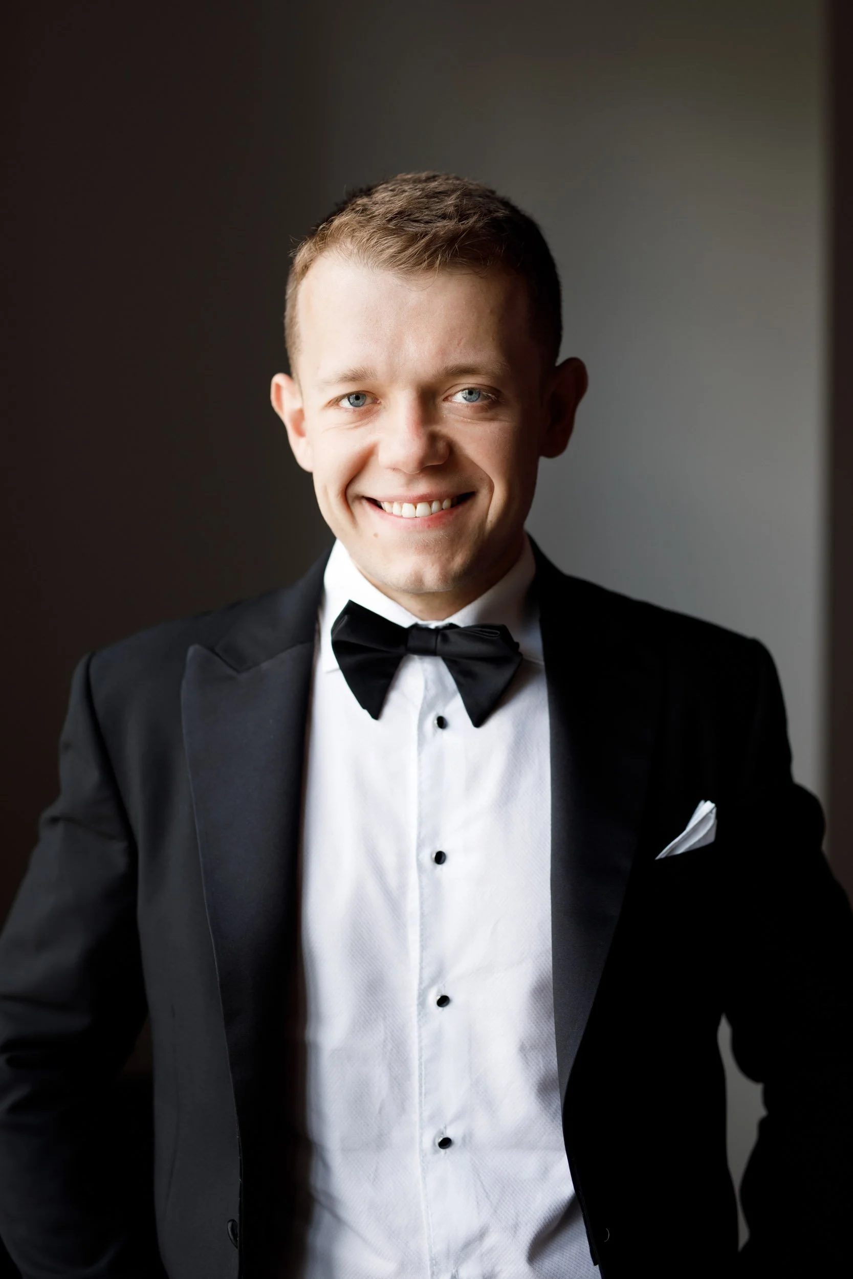 Groom smiling before his St. George’s Golf Club wedding in Toronto