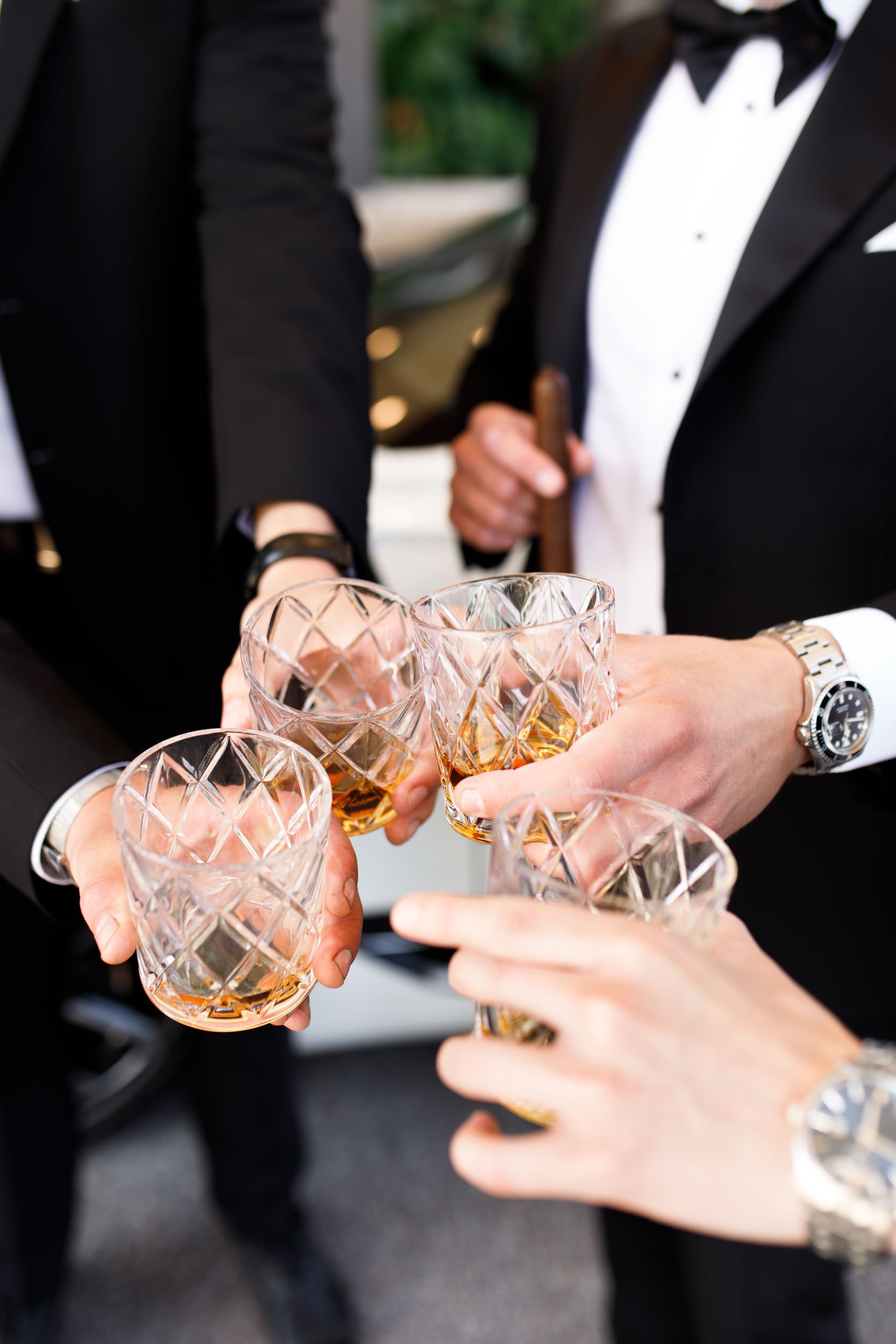 Groomsmen toasting glasses before a St. George’s Golf Club wedding in Toronto