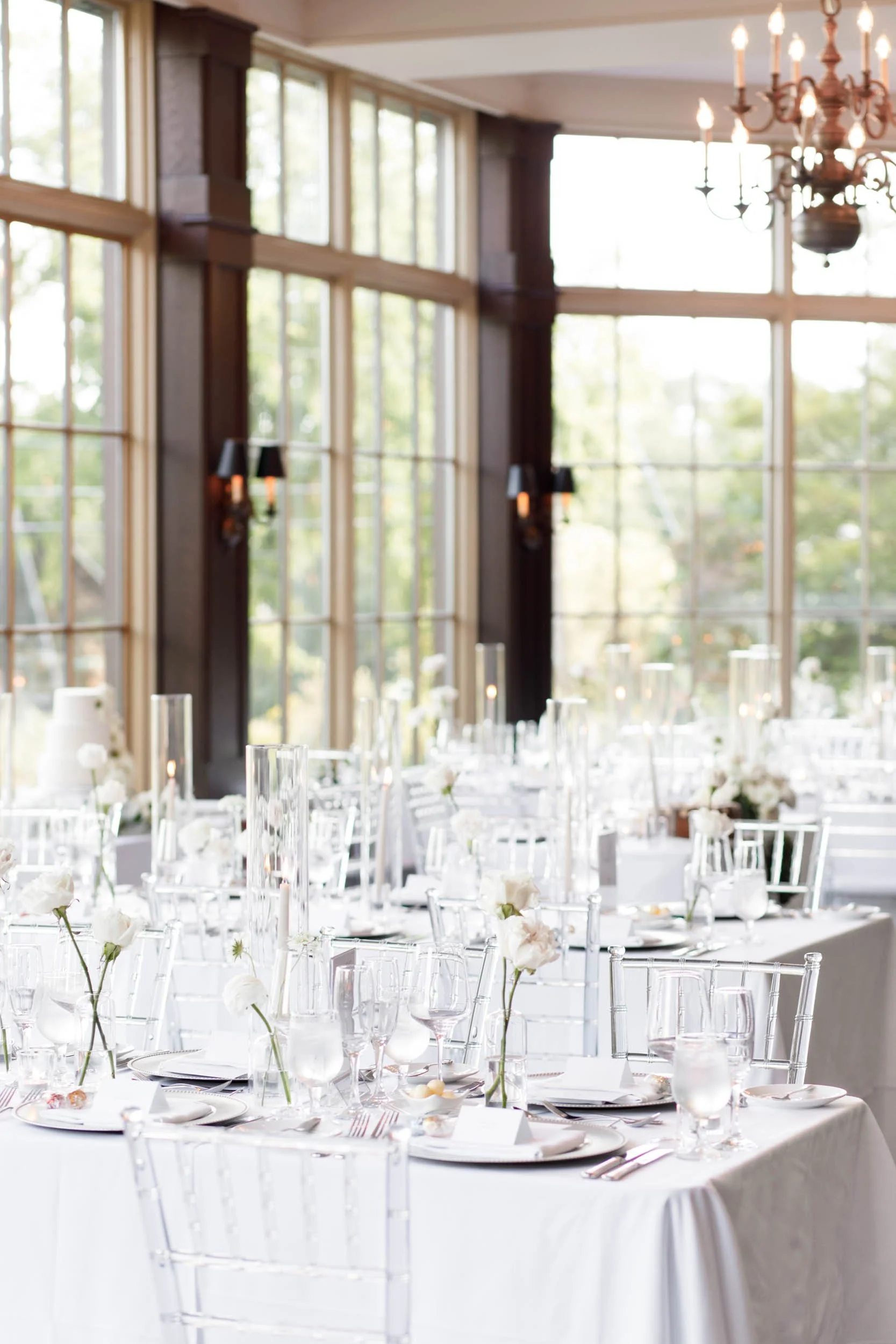 Bright wedding reception room with chandeliers at St. George’s Golf Club in Toronto