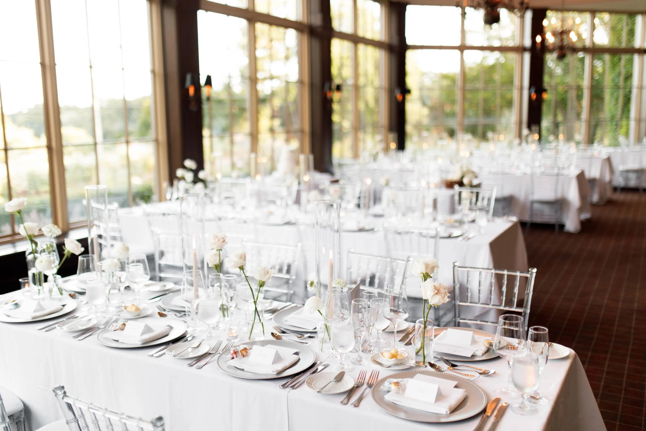 Long banquet tables prepared for a Toronto wedding at St. George’s Golf and Country Club