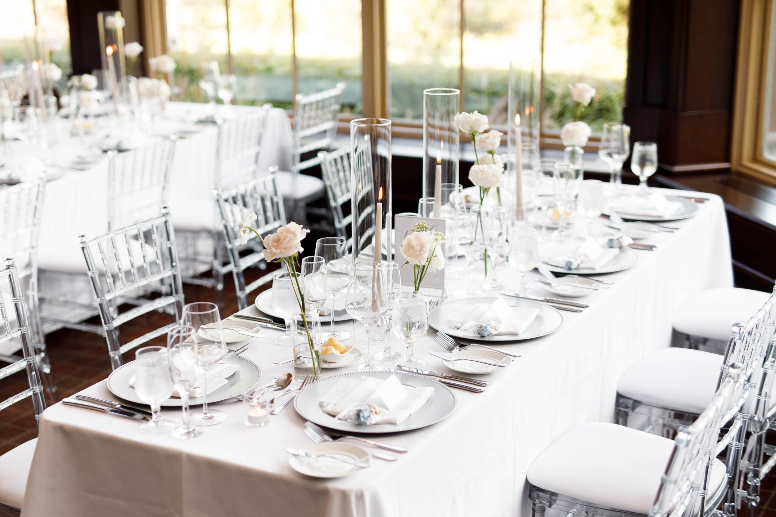 Reception room with chandeliers and window light at St. George’s Golf and Country Club in Toronto