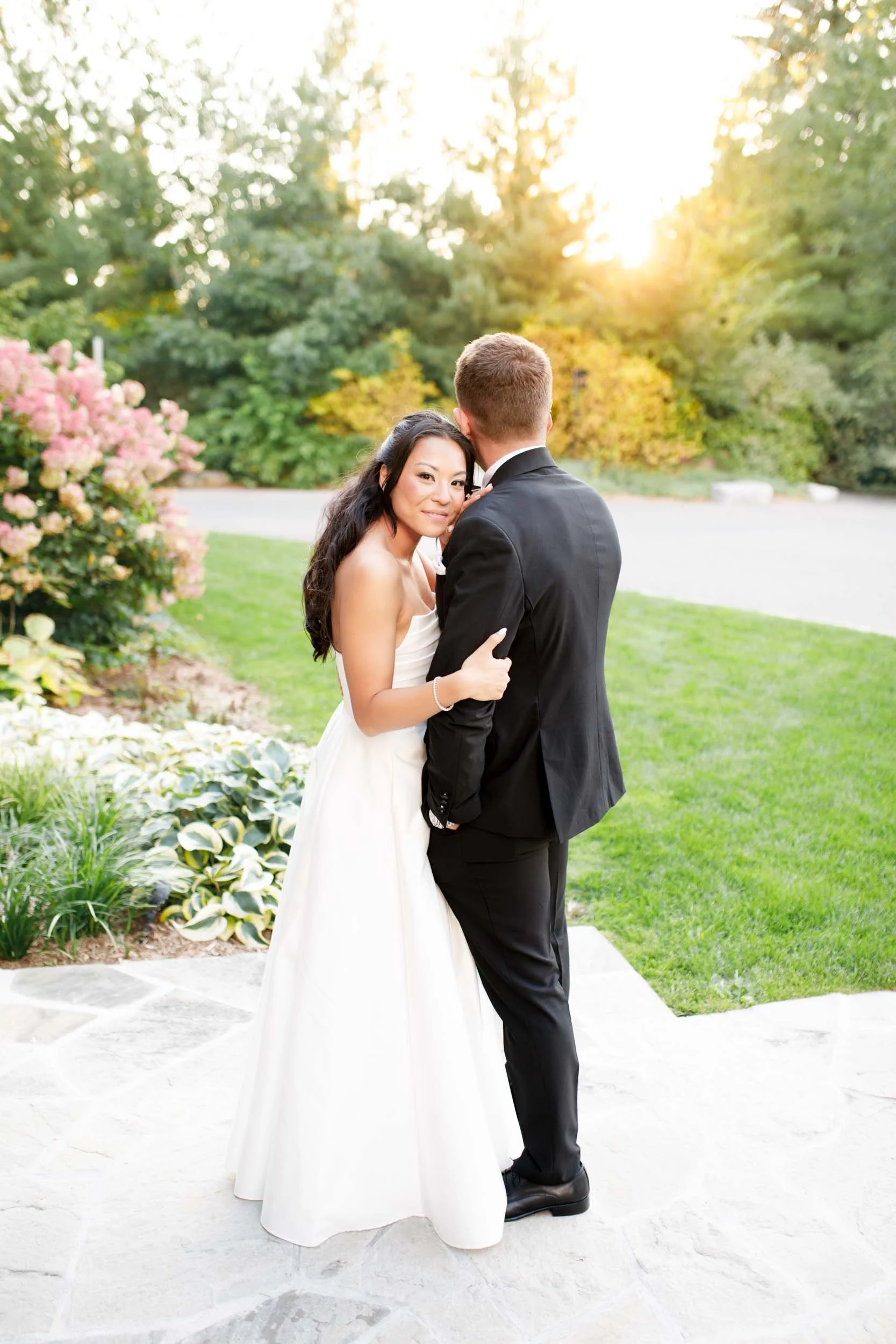 Bride and groom posing together at sunset at St. George’s Golf and Country Club in Toronto