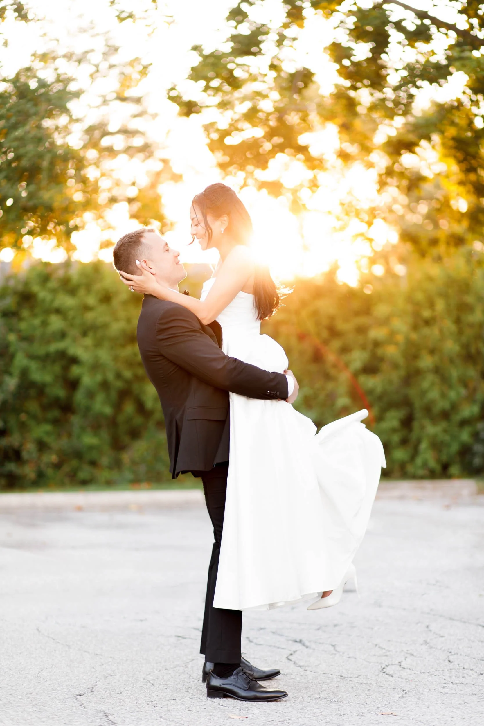 Silhouetted bride and groom in glowing sunset light at St. George’s Golf and Country Club in Toronto