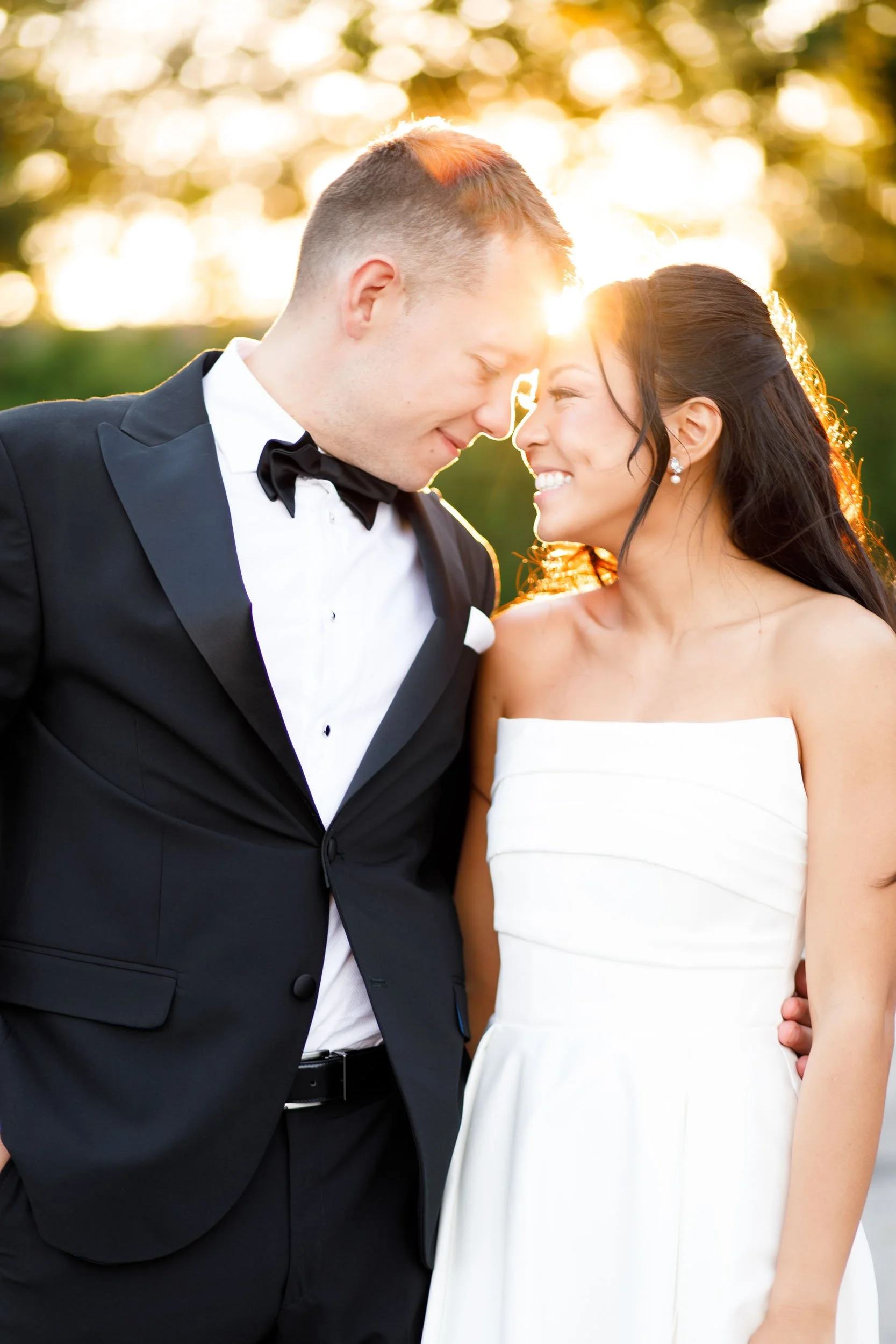 Bride and groom walking together at sunset during their St. George’s Golf Club wedding in Toronto