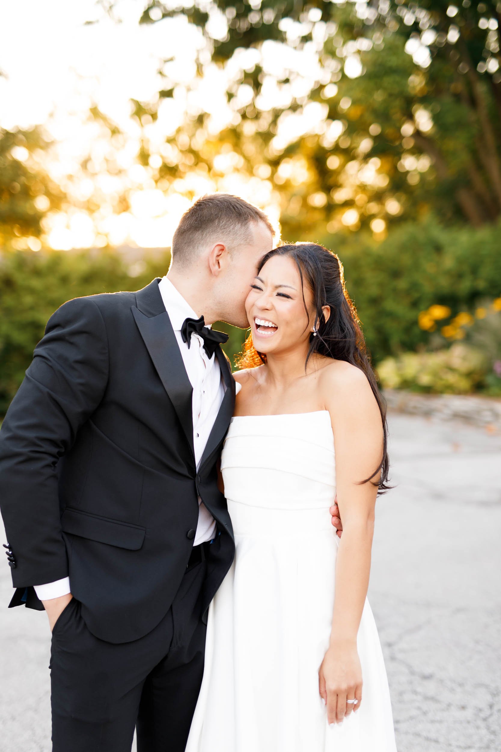 Bride and groom smiling together during sunset portraits at St. George’s Golf Club in Toronto