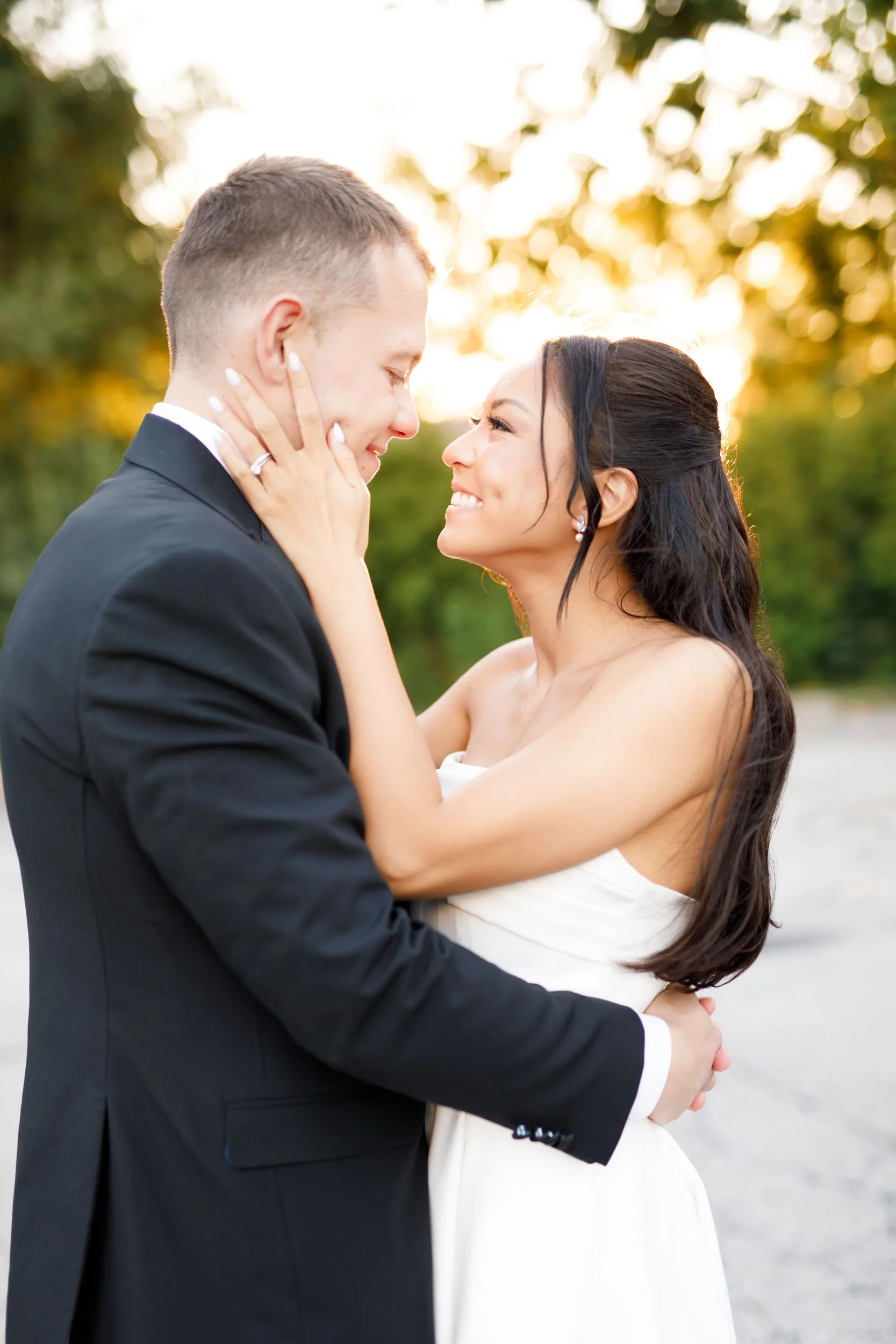 Bride holding the groom’s face during a St. George’s Golf and Country Club wedding in Toronto