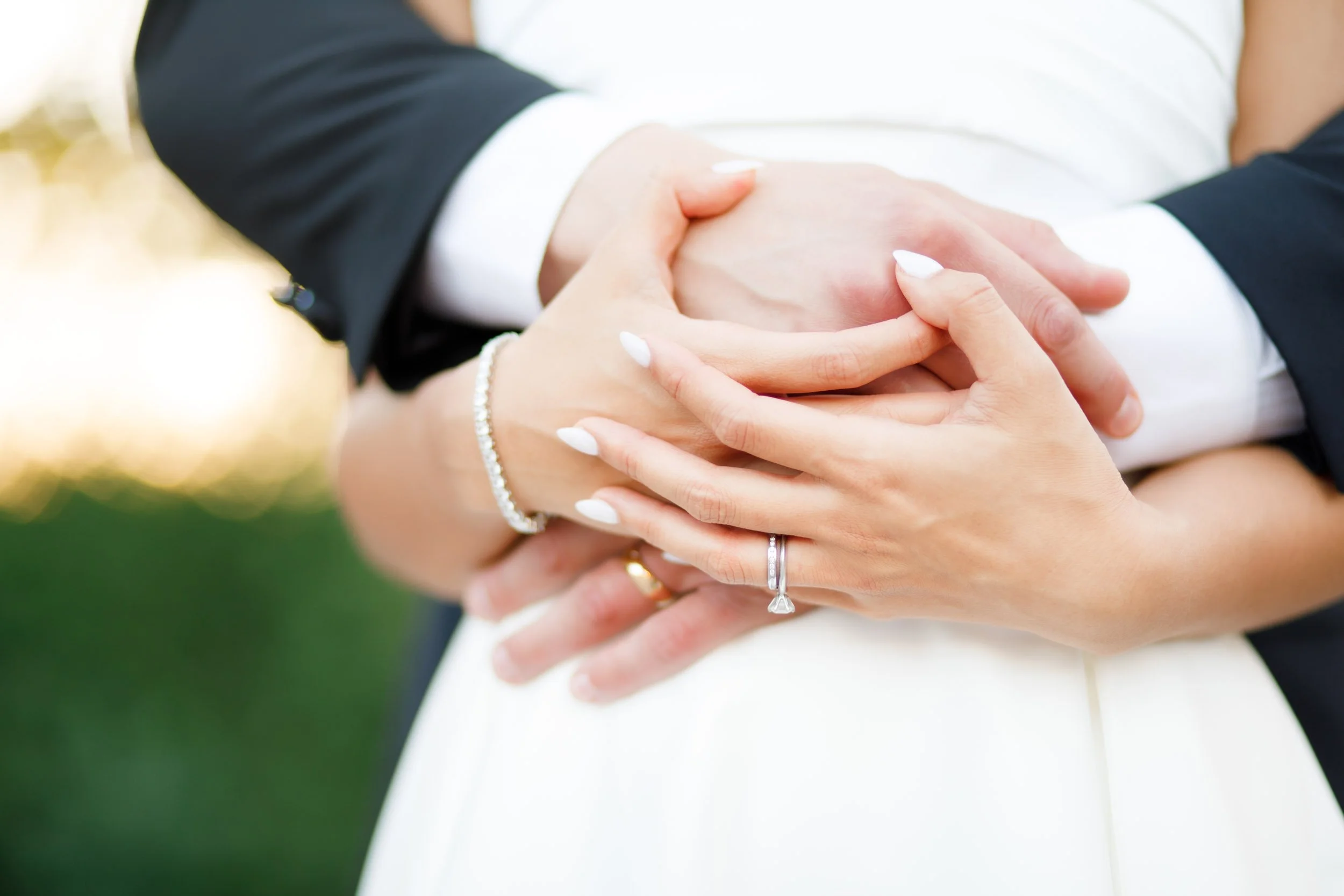 Close-up of the bride and groom holding hands during their St. George’s Golf Club wedding in Toronto