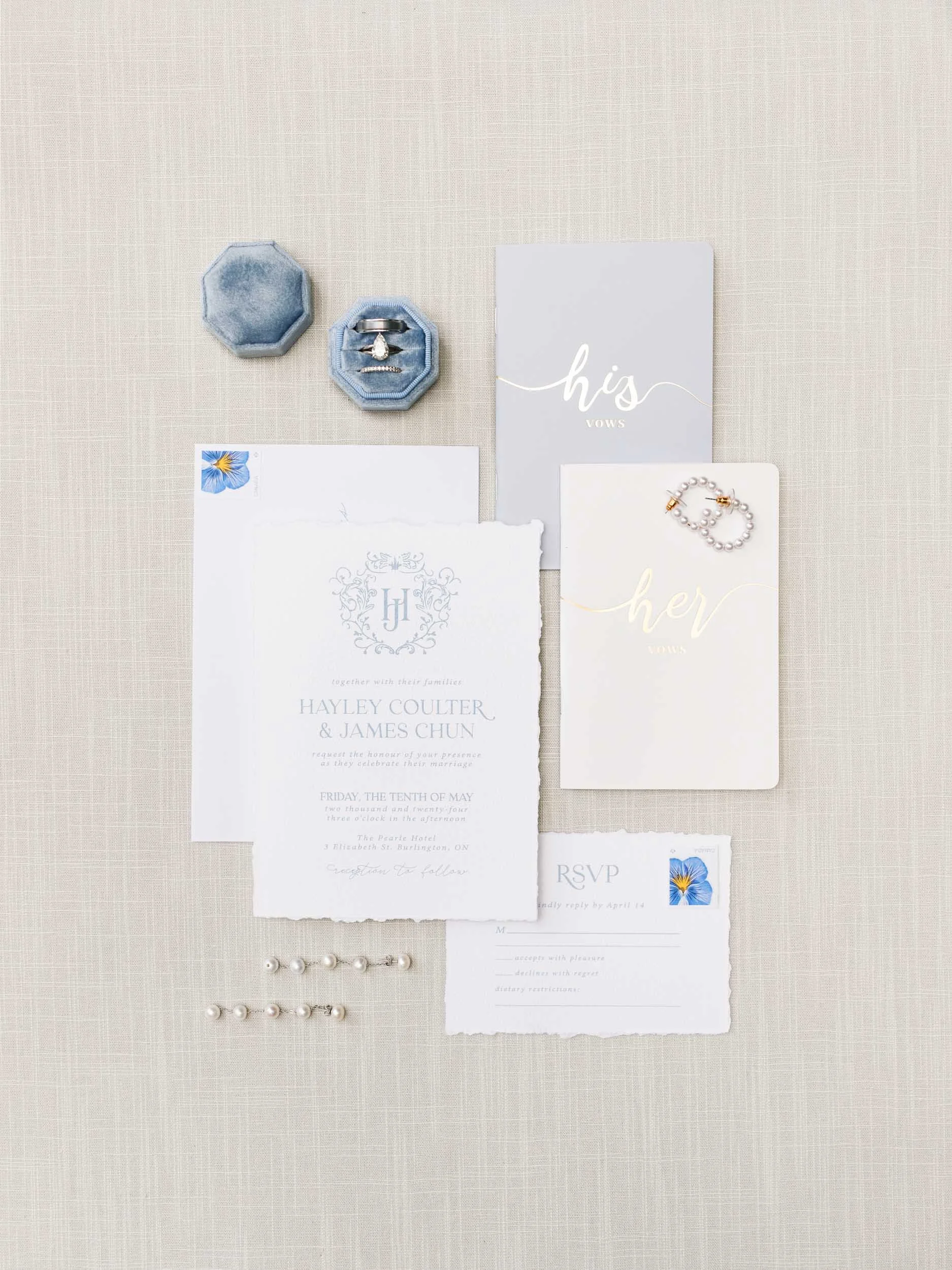 Wedding invitation suite and rings from a Pearle Hotel wedding in Burlington, Ontario