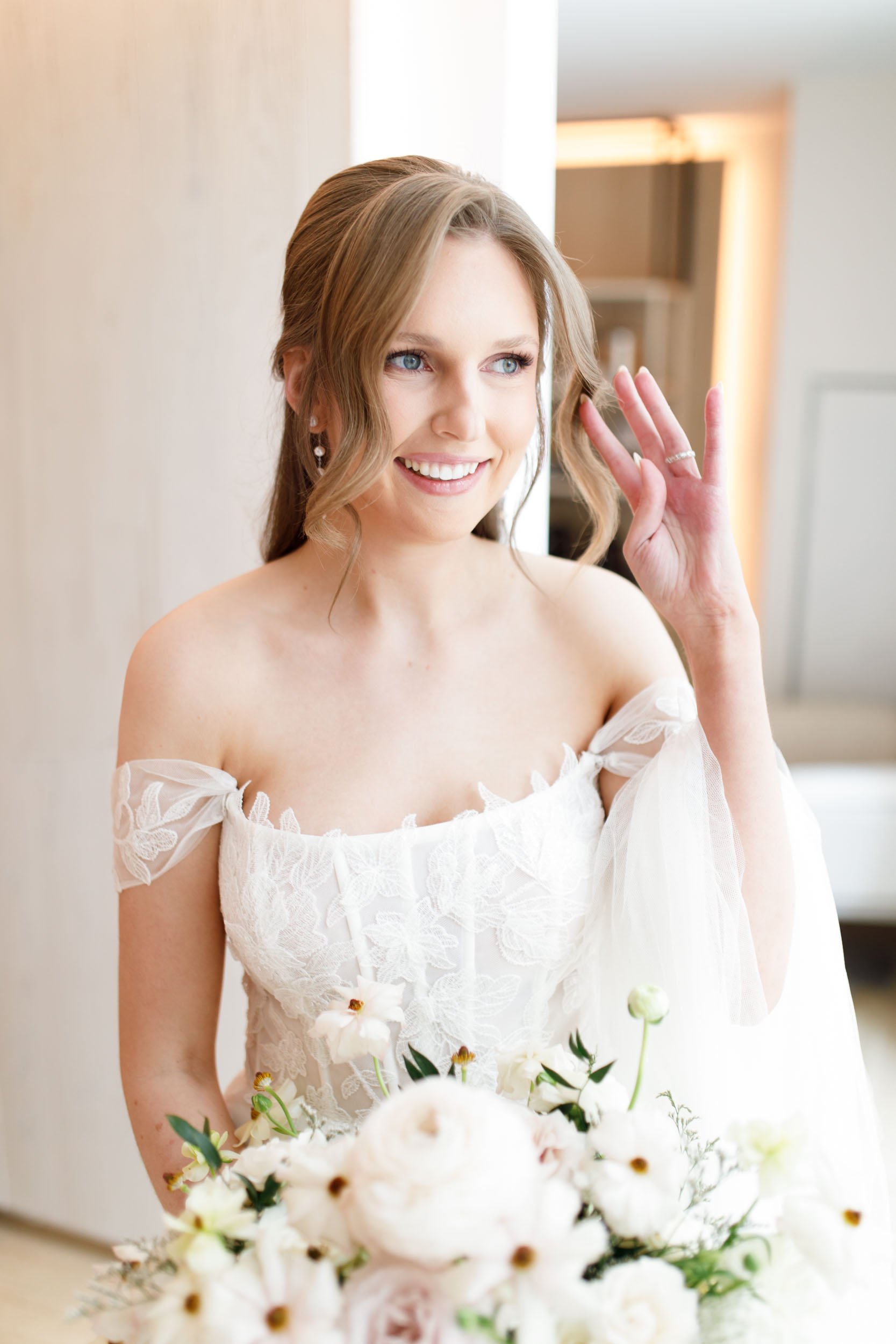 Bride smiling in her wedding dress at the Pearle Hotel in Burlington Ontario