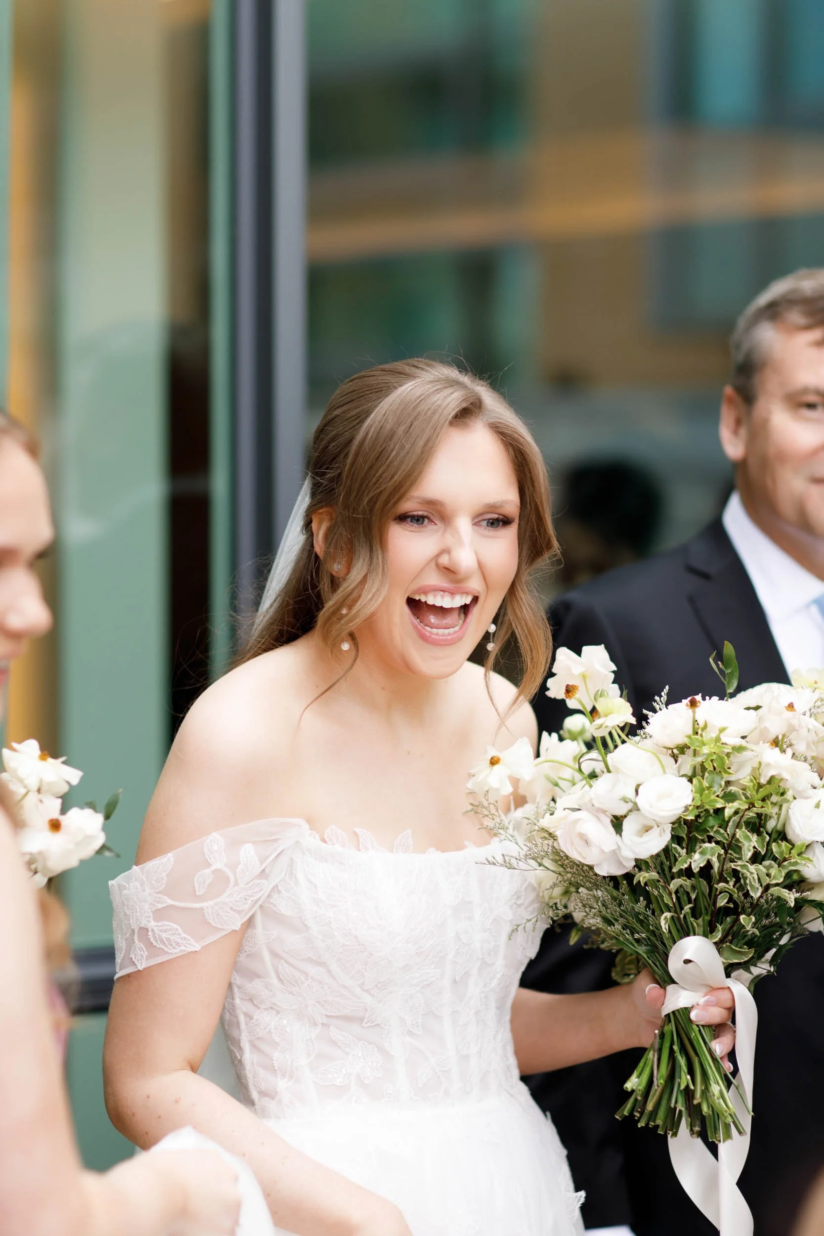 Bride walking with her bridesmaids at the Pearle Hotel in Burlington Ontario