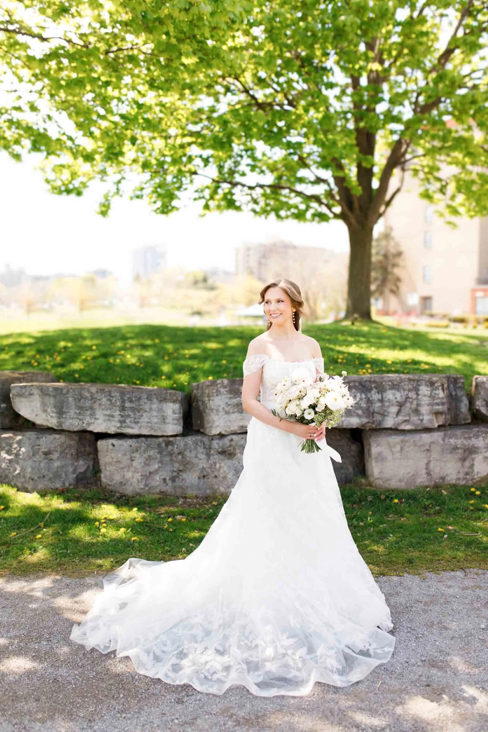 Bride standing alone with her bouquet at the Pearle Hotel in Burlington Ontario