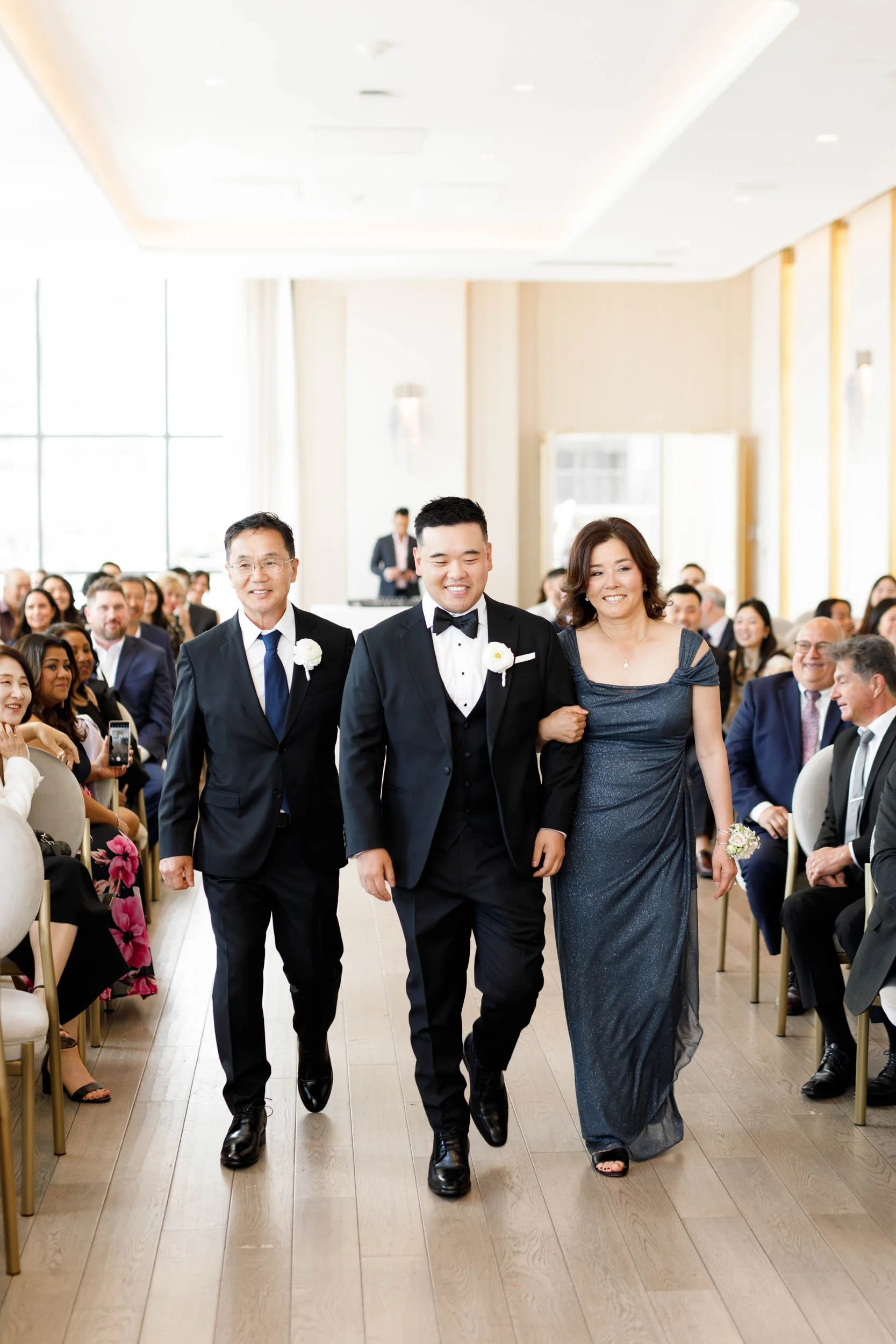 Bride walking down the aisle at the Pearle Hotel in Burlington Ontario