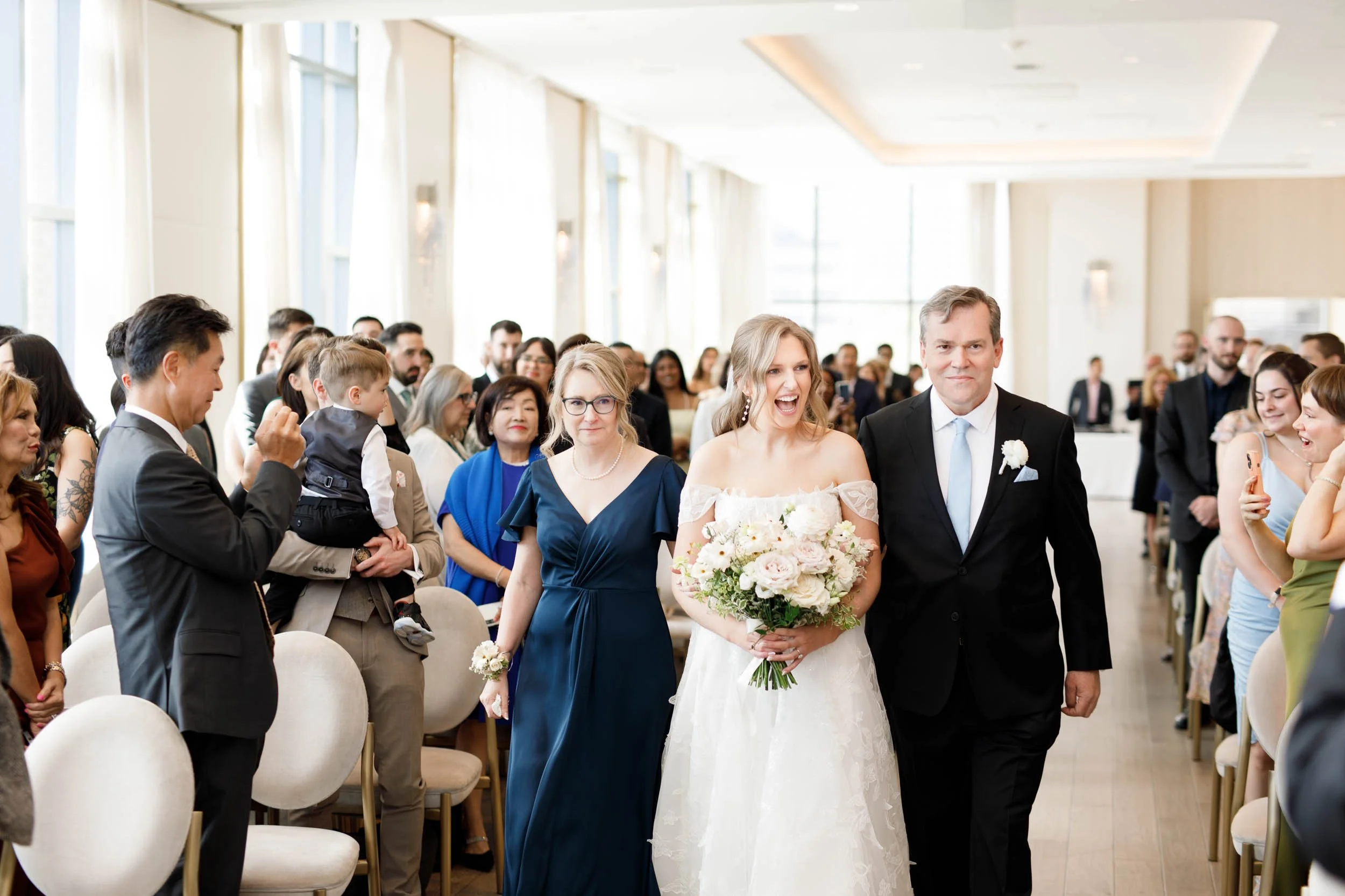 Bride walking down the aisle with her father at the Pearle Hotel in Burlington Ontario