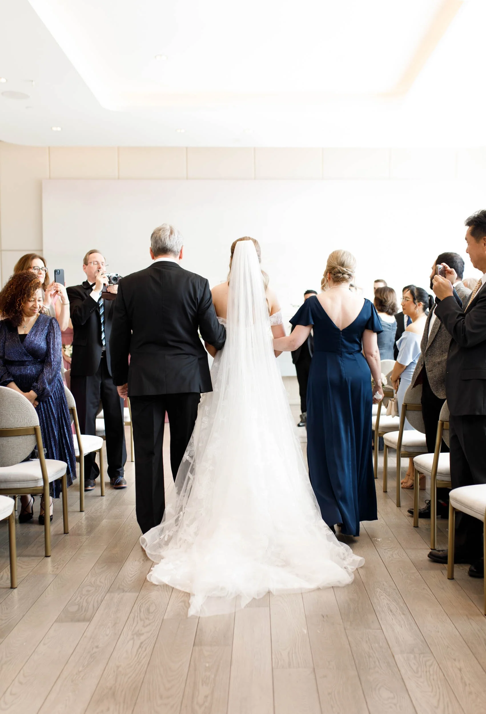 Bride and groom walking away together after their ceremony at the Pearle Hotel in Burlington Ontario