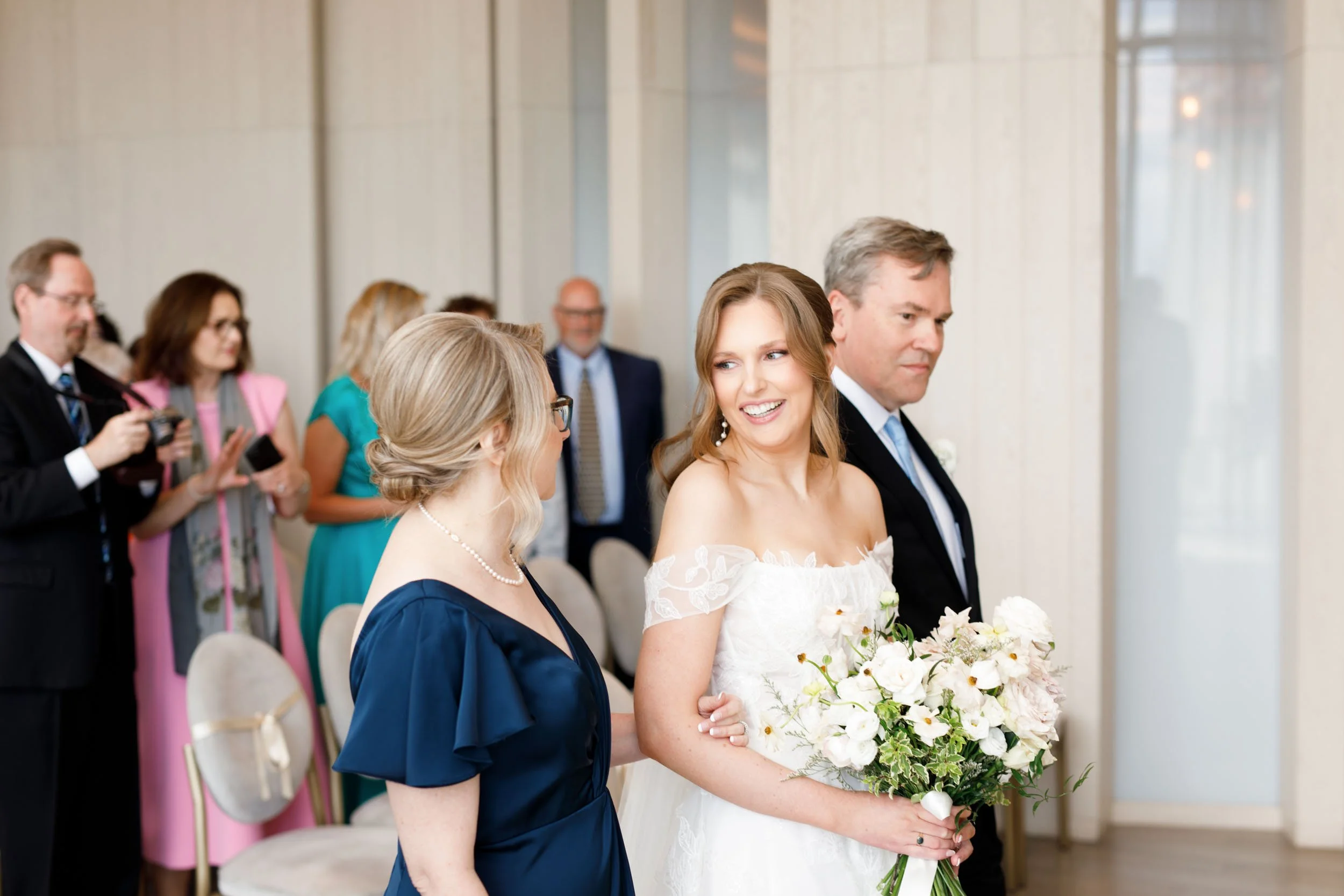 Bride smiling at her mother during her ceremony at the Pearle Hotel in Burlington Ontario