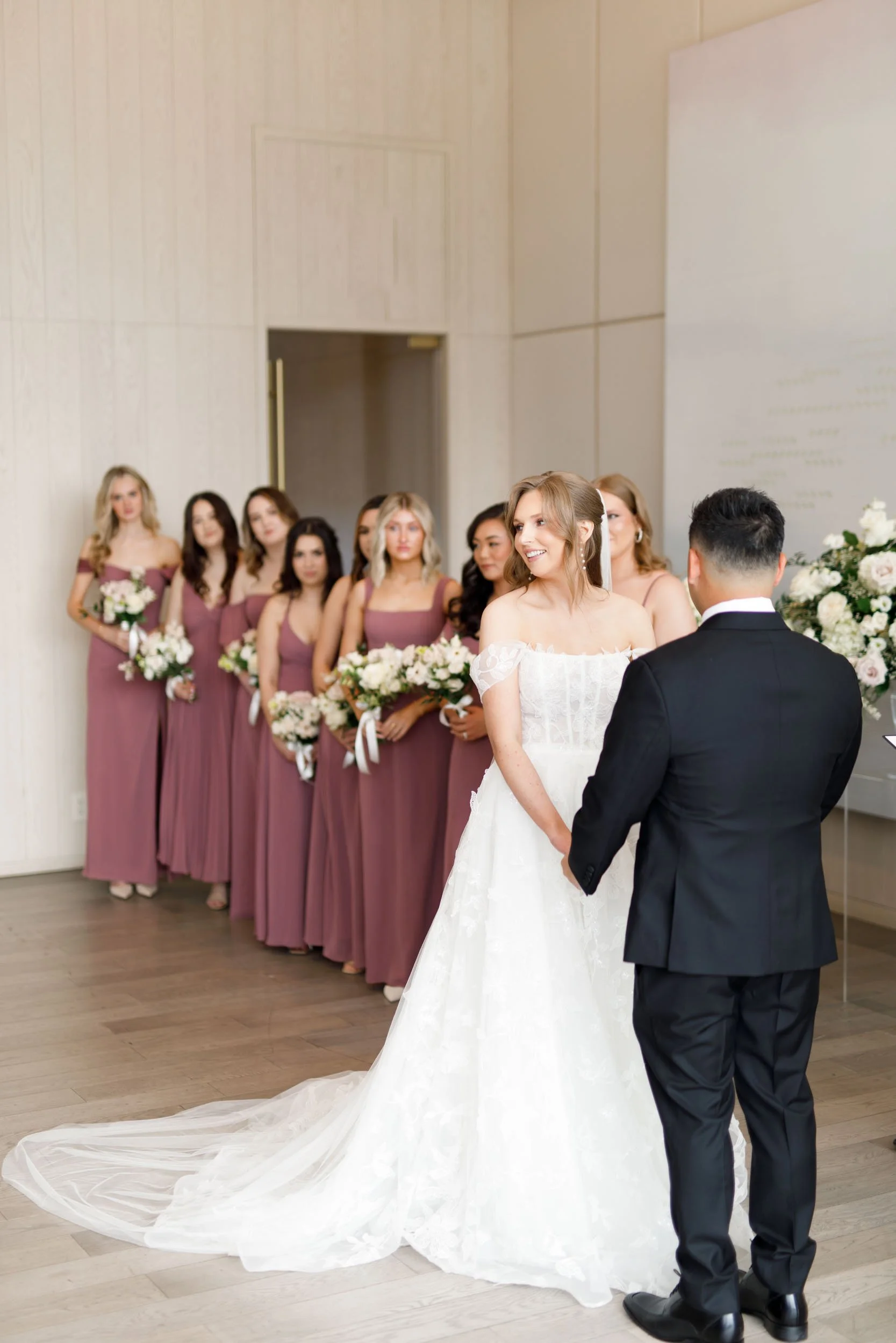 Bride and groom standing together during their ceremony at the Pearle Hotel in Burlington Ontario