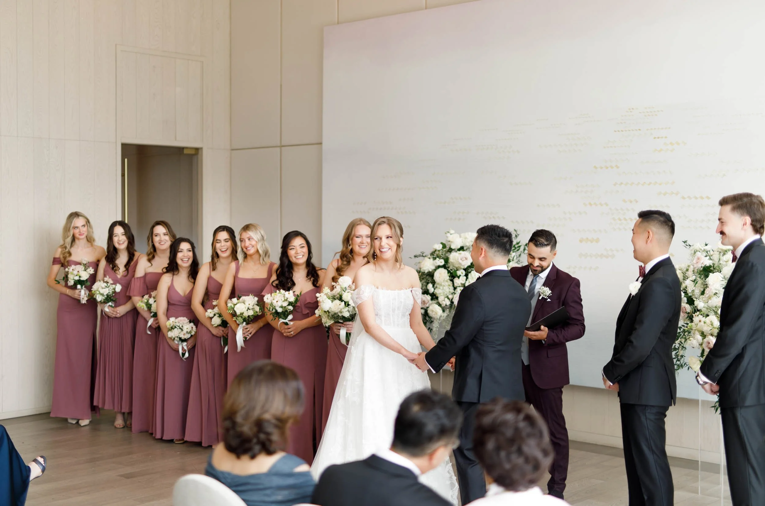 Bride and groom standing at the altar during their Pearle Hotel wedding ceremony in Burlington Ontario
