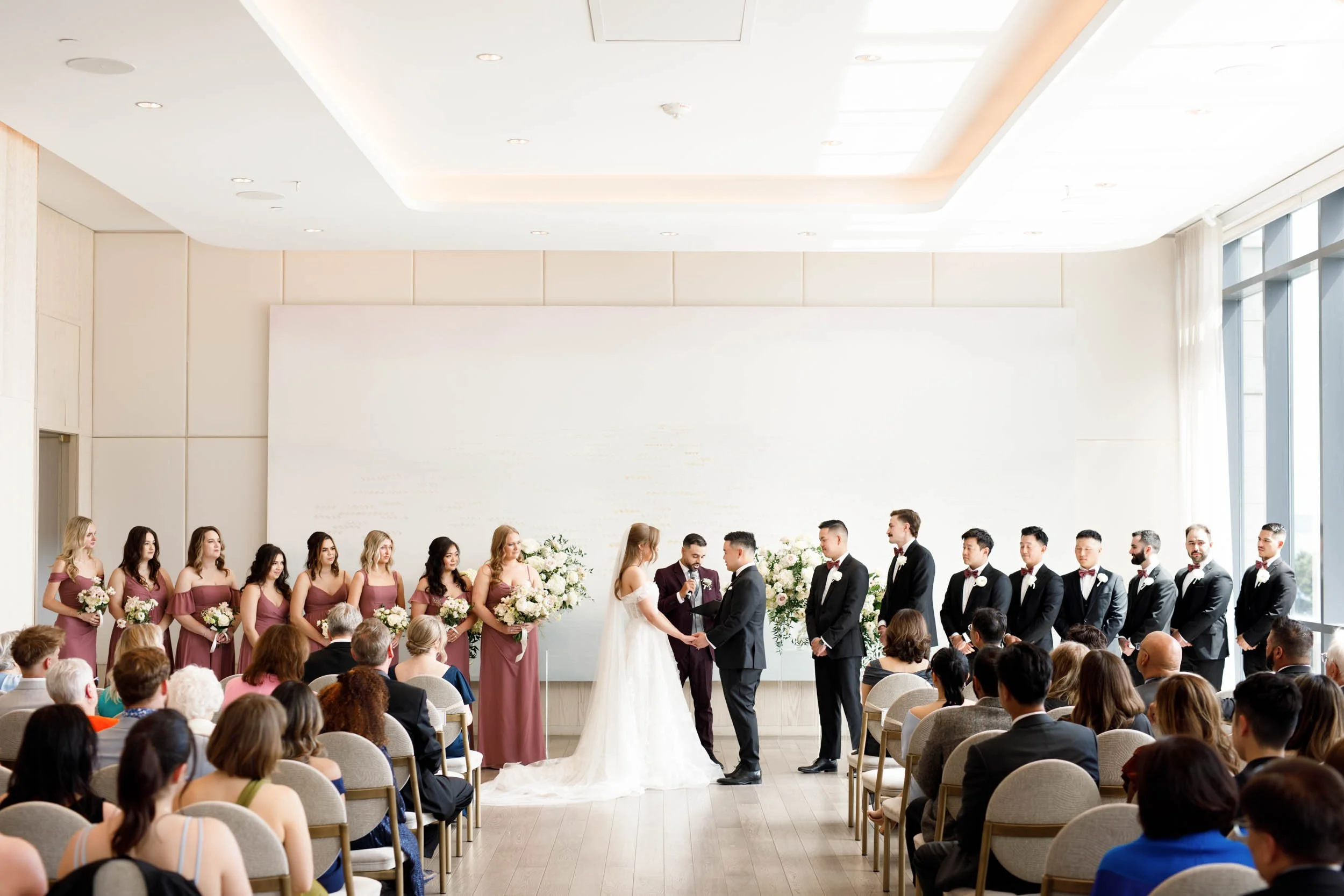 Bridal party lined up during a Pearle Hotel wedding ceremony in Burlington Ontario