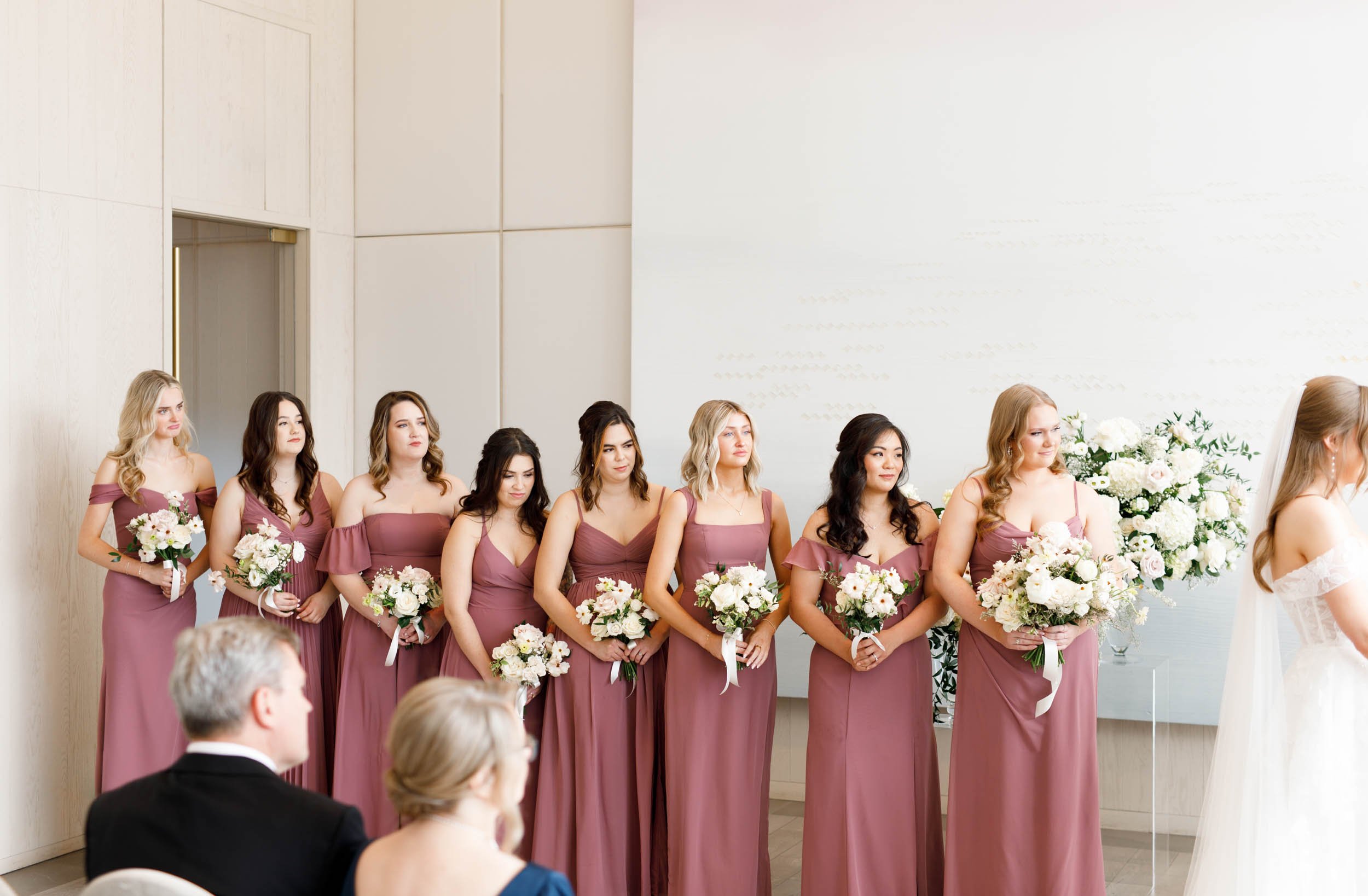 Bridesmaids standing during the wedding ceremony at the Pearle Hotel in Burlington Ontario
