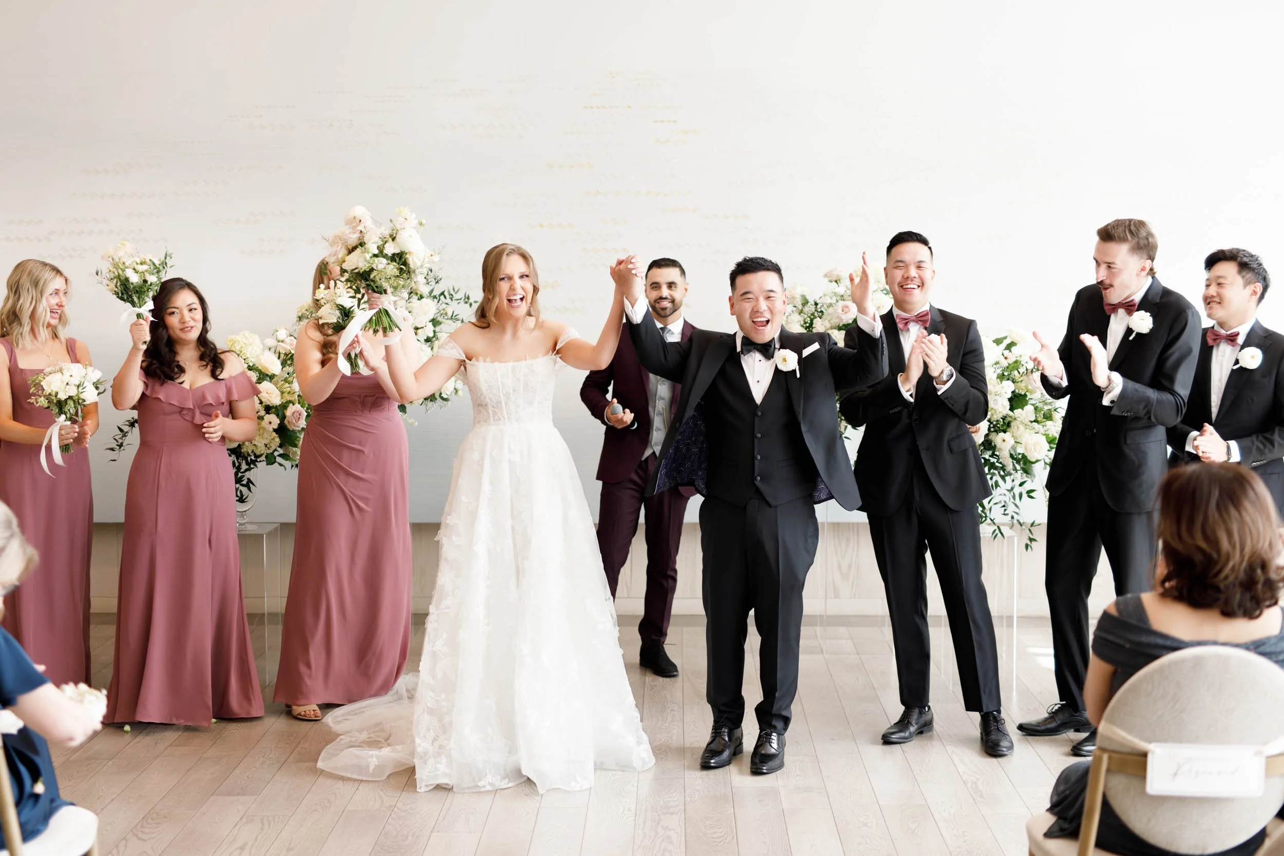 Wedding party celebrating after the ceremony at the Pearle Hotel in Burlington Ontario