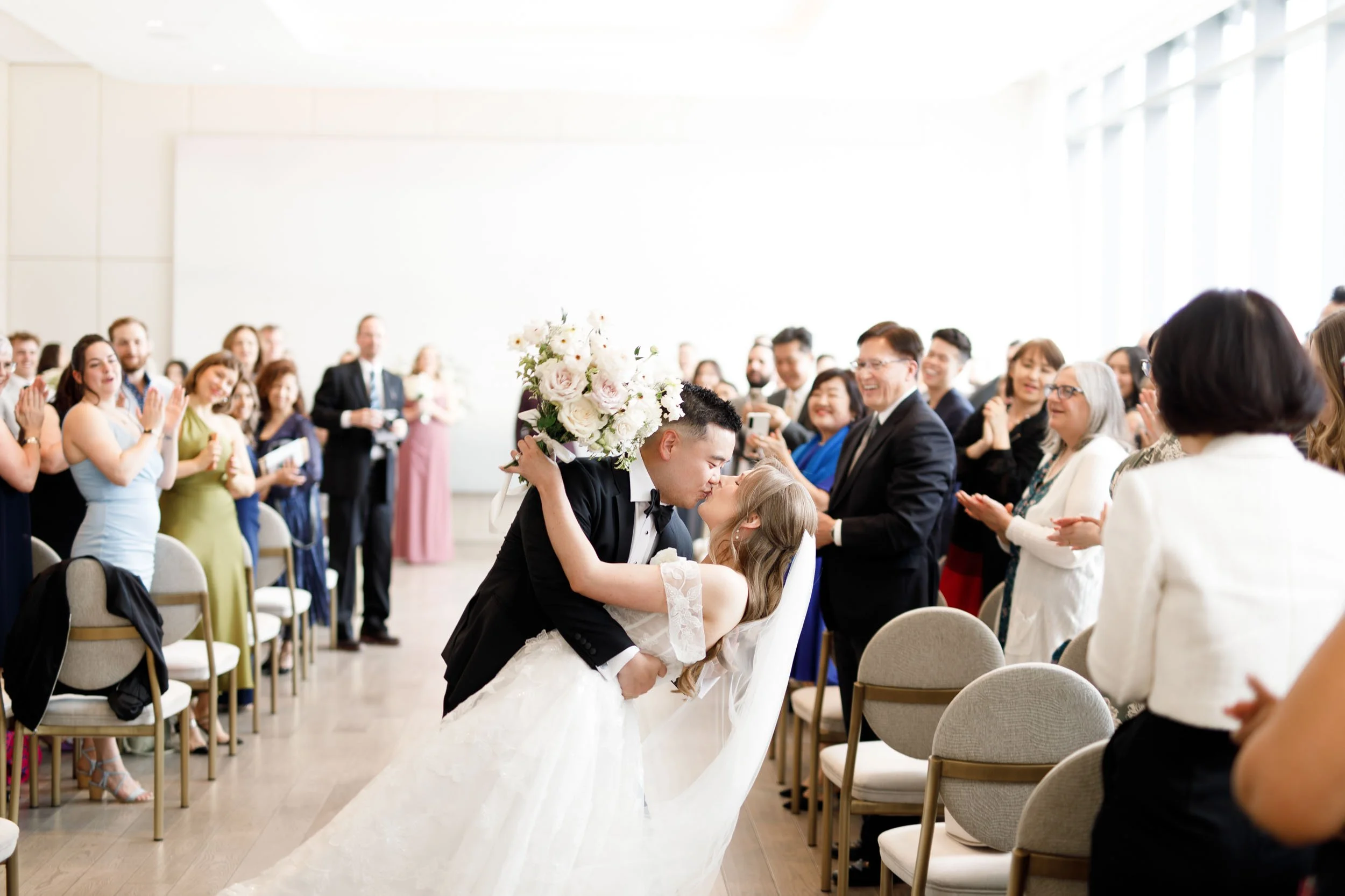 Bride and groom kissing after their ceremony at the Pearle Hotel in Burlington Ontario