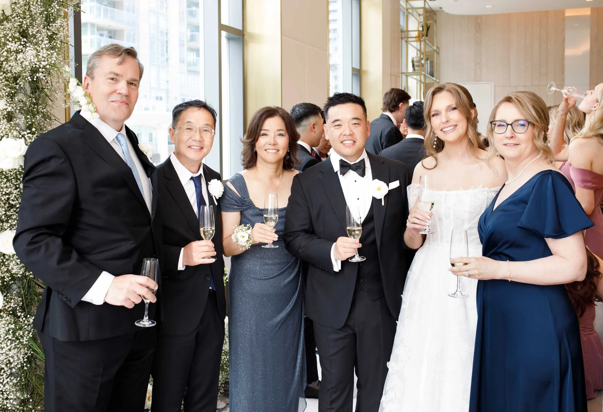 Wedding guests toasting the couple at the Pearle Hotel in Burlington Ontario