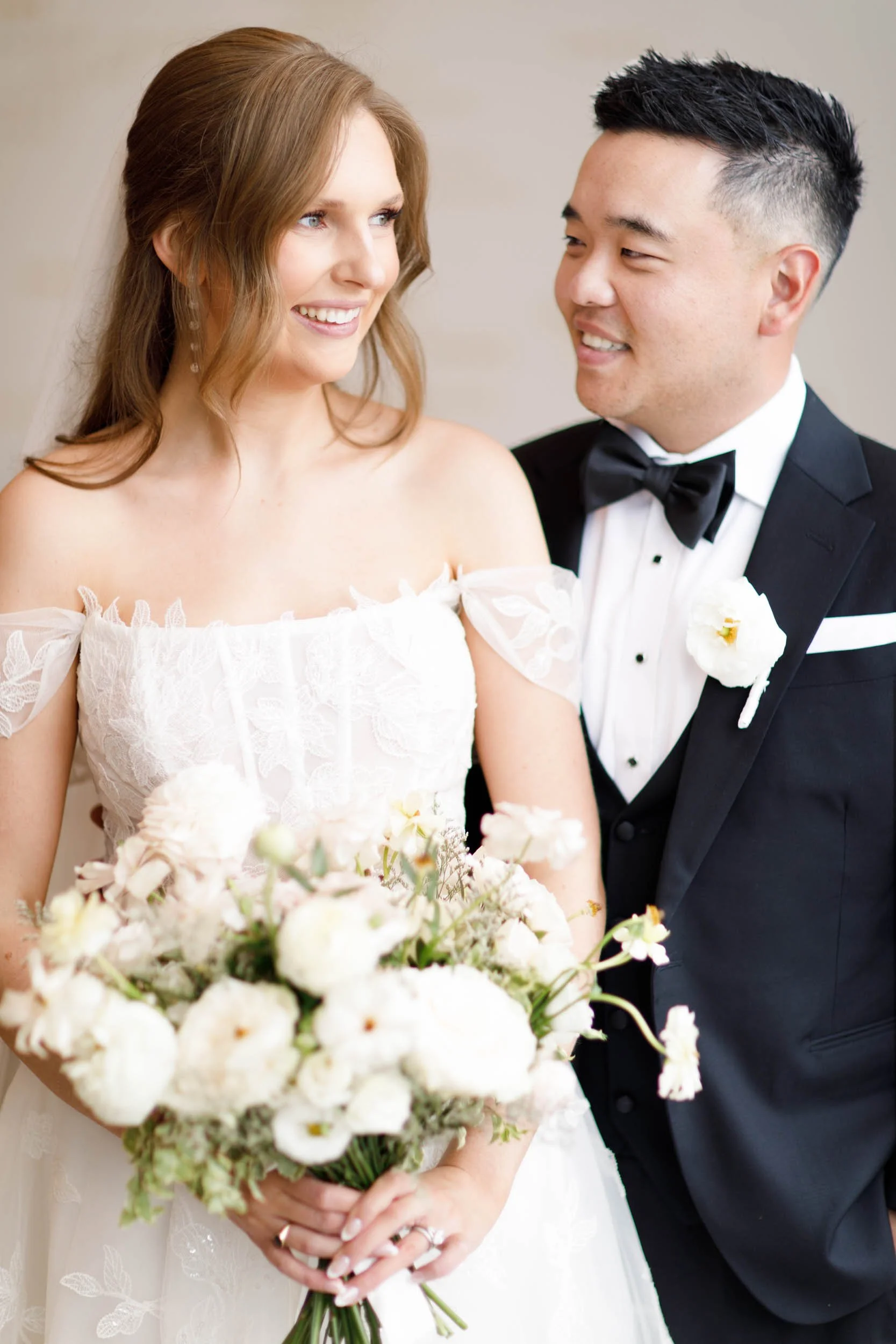 Bride and groom smiling together at the Pearle Hotel in Burlington Ontario