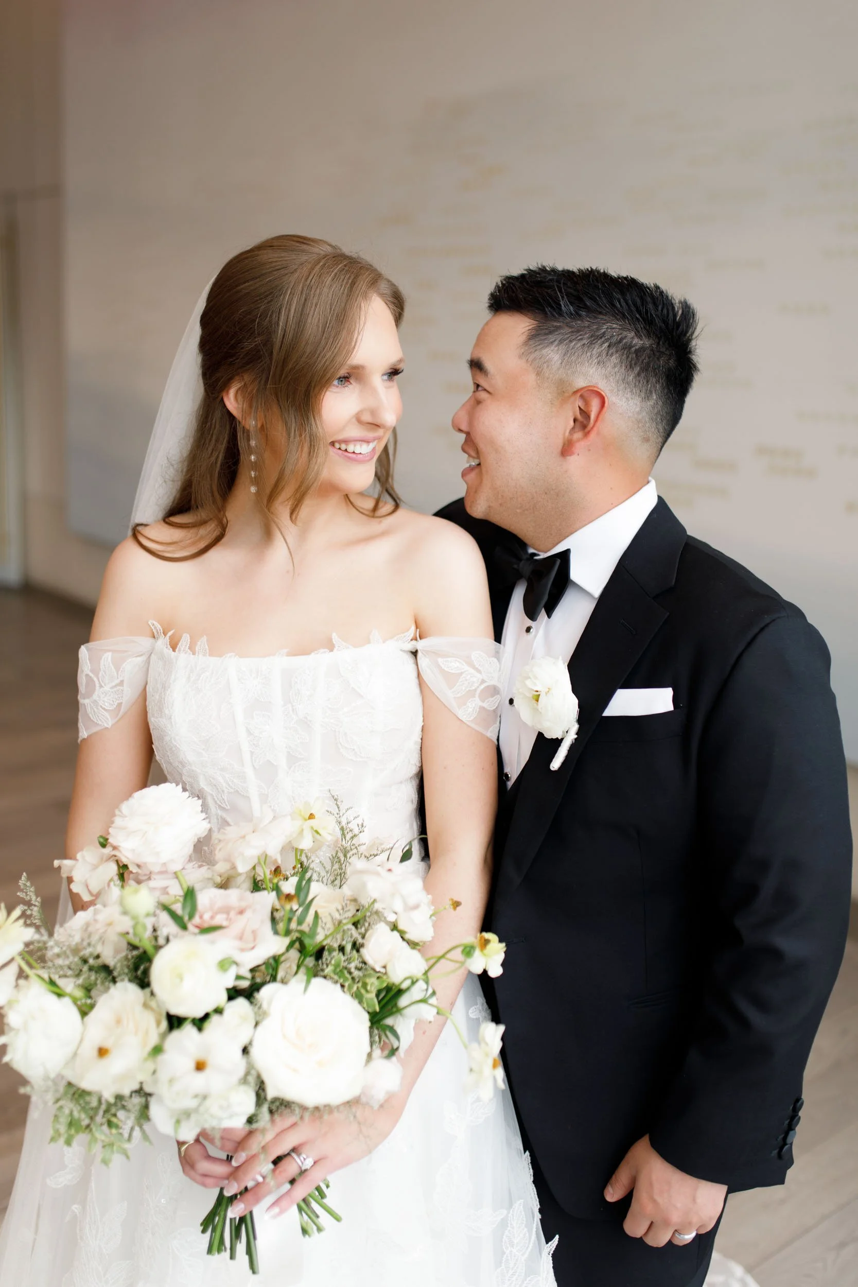 Bride and groom smiling at each other during their Pearle Hotel wedding in Burlington Ontario