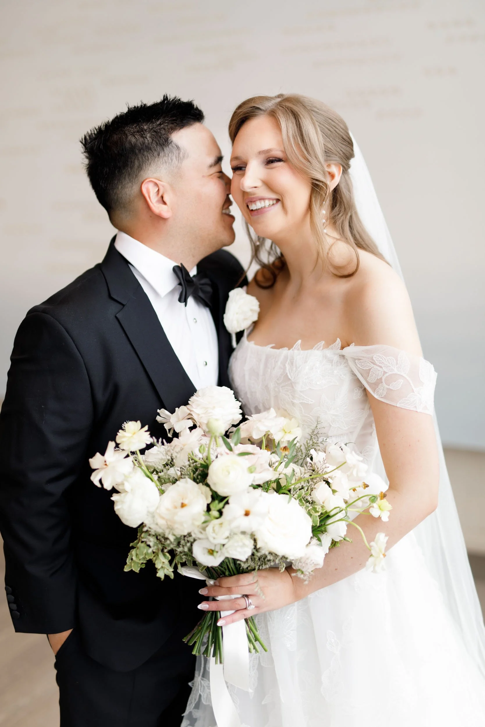 Bride and groom sharing a laugh during their Pearle Hotel wedding in Burlington Ontario