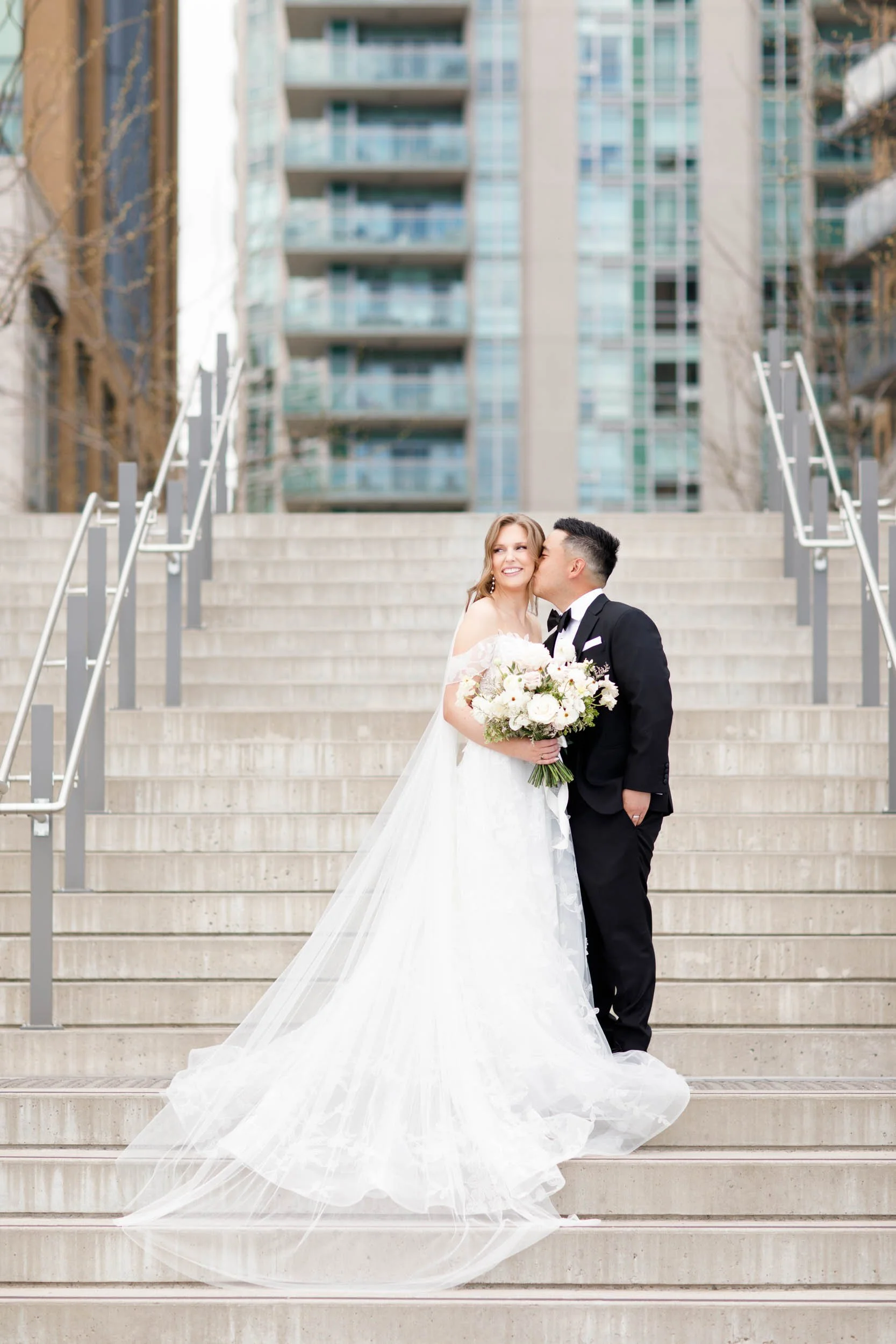 Bride and groom standing together outside the Pearle Hotel in Burlington Ontario