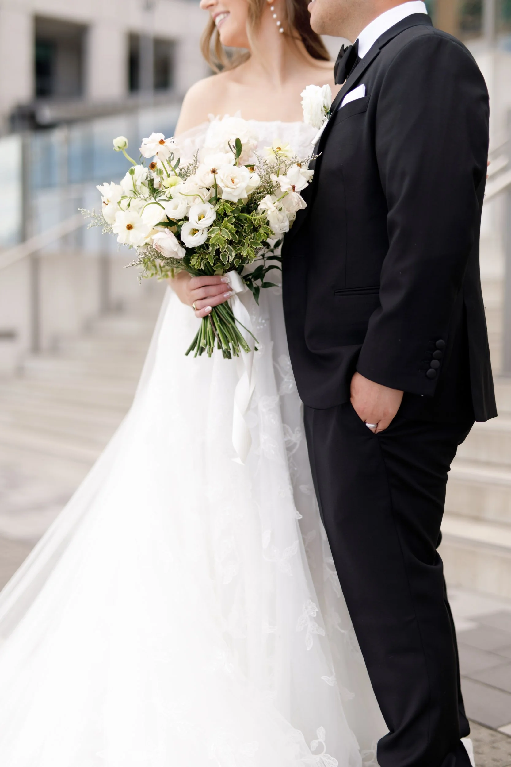 Bride holding her bouquet beside the groom at the Pearle Hotel in Burlington Ontario