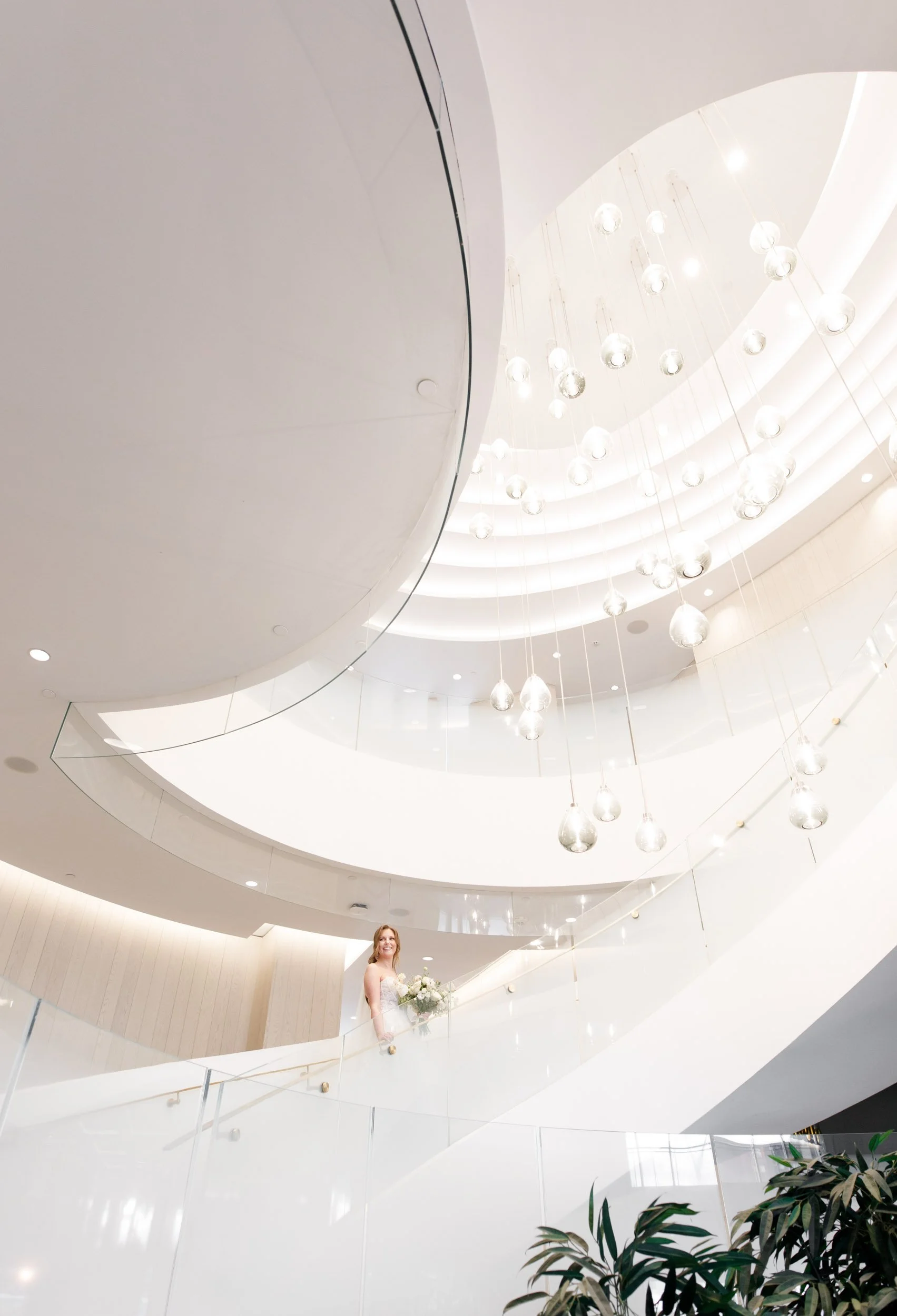 Bride standing on the grand staircase inside the Pearle Hotel in Burlington Ontario