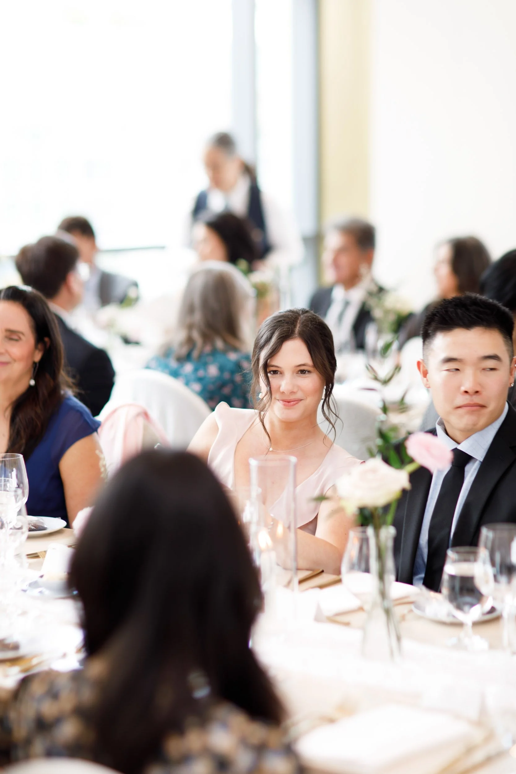 Wedding guests seated at tables during a Pearle Hotel wedding reception in Burlington Ontario