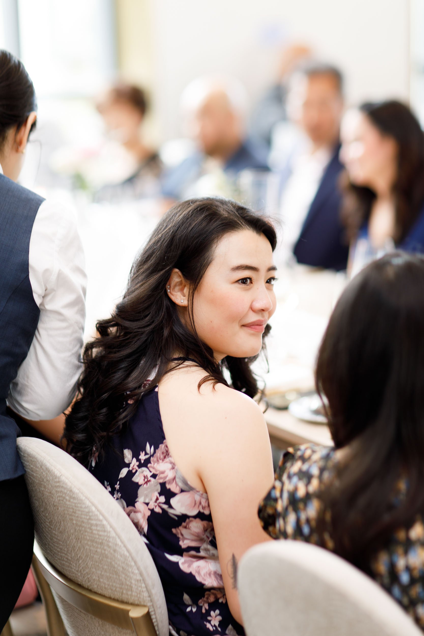 Wedding guest smiling during a Pearle Hotel wedding in Burlington Ontario