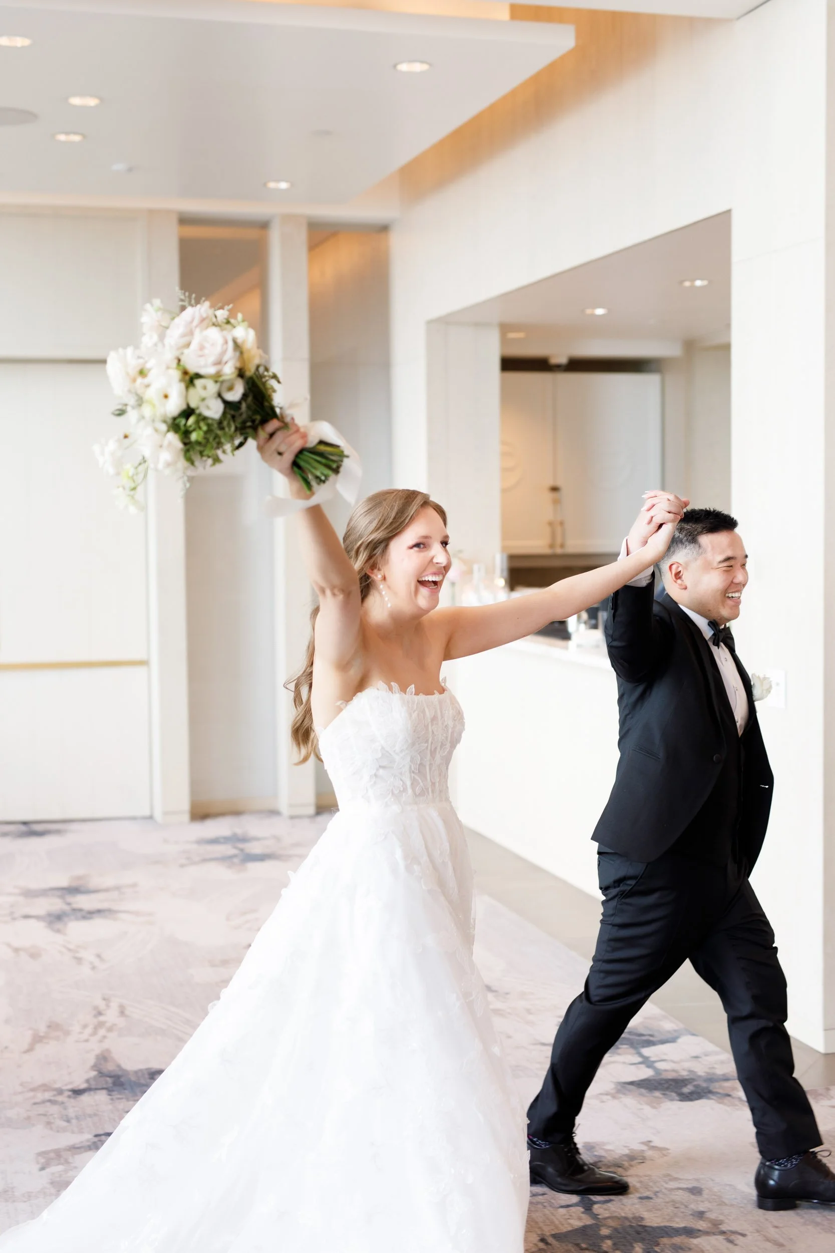 Bride and groom entering the reception hall at the Pearle Hotel in Burlington Ontario