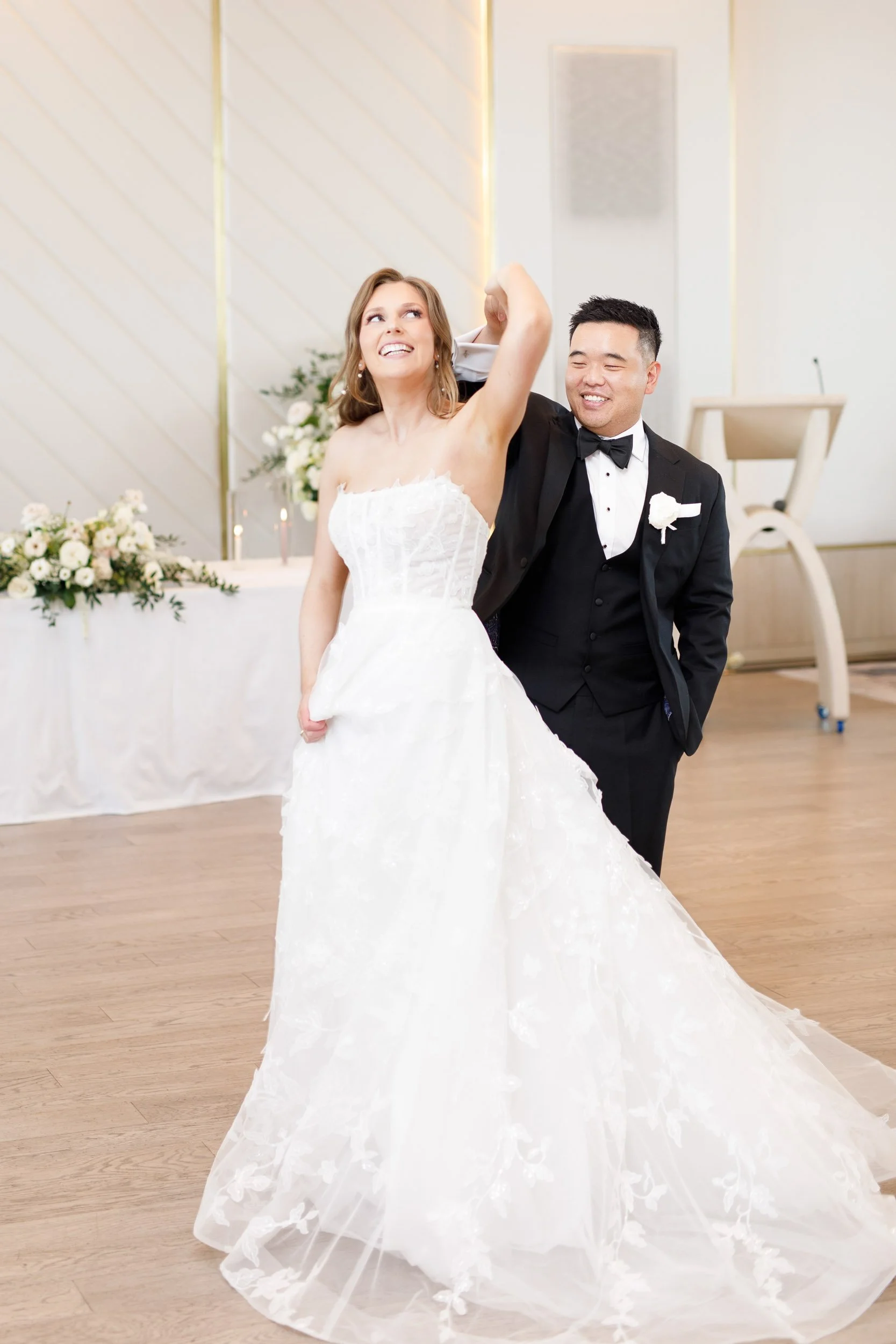 Bride and groom twirling and dancing the Pearle Hotel ballroom in Burlington Ontario