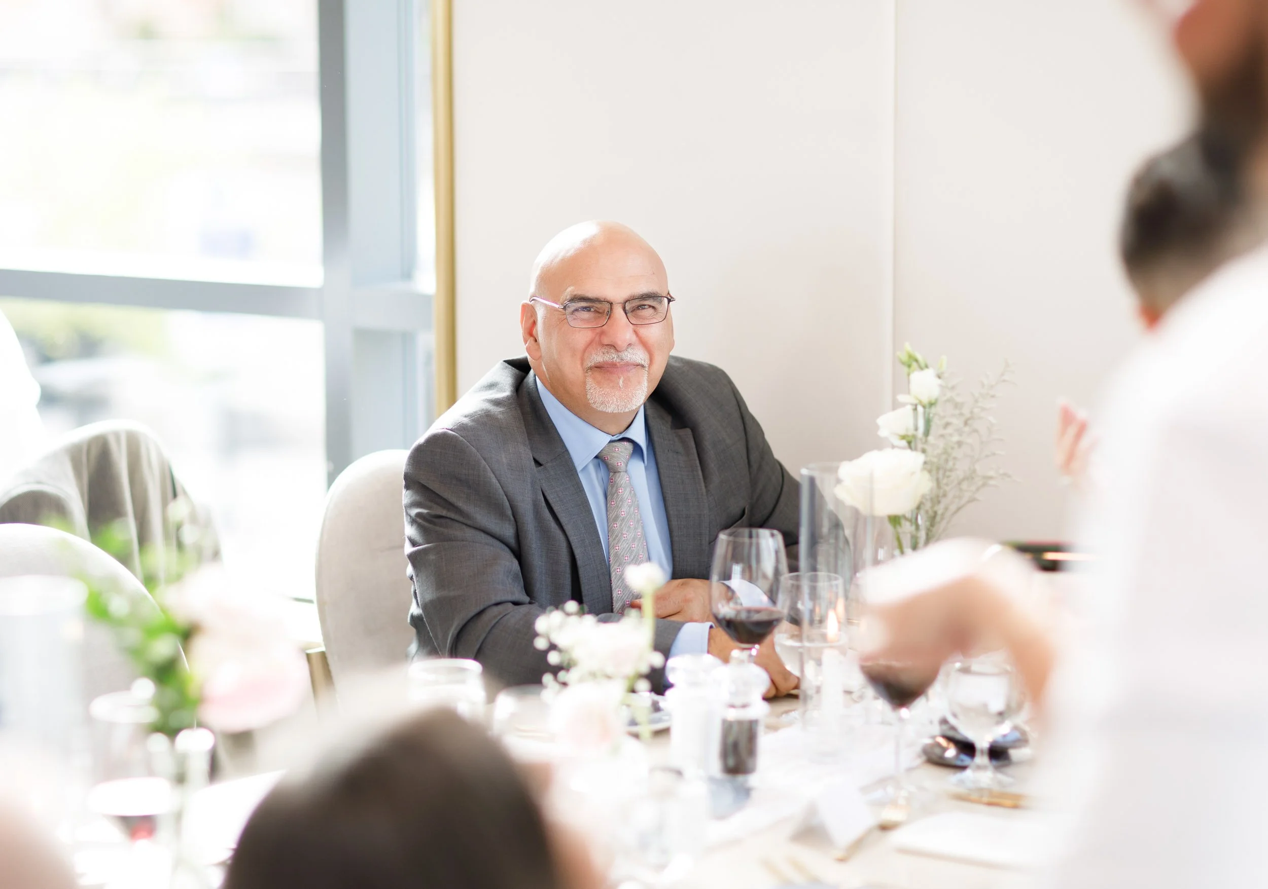 Wedding guest listening during a Pearle Hotel wedding reception in Burlington Ontario