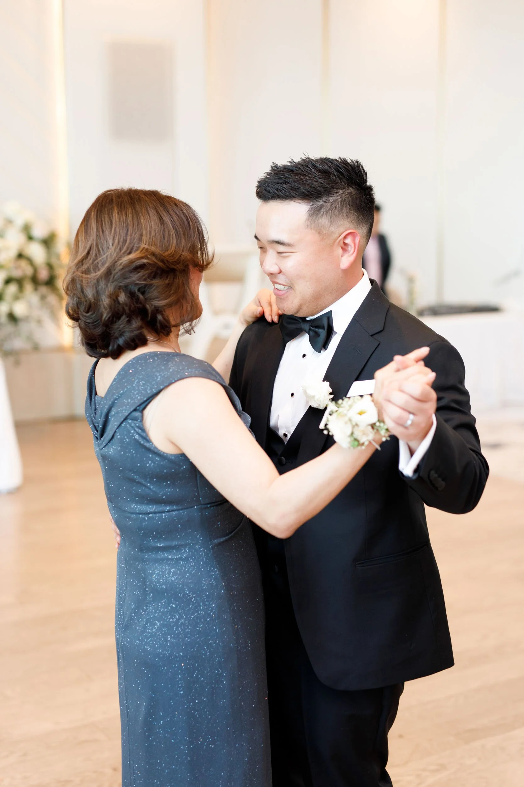 Bride dancing with a guest at the Pearle Hotel wedding reception in Burlington Ontario