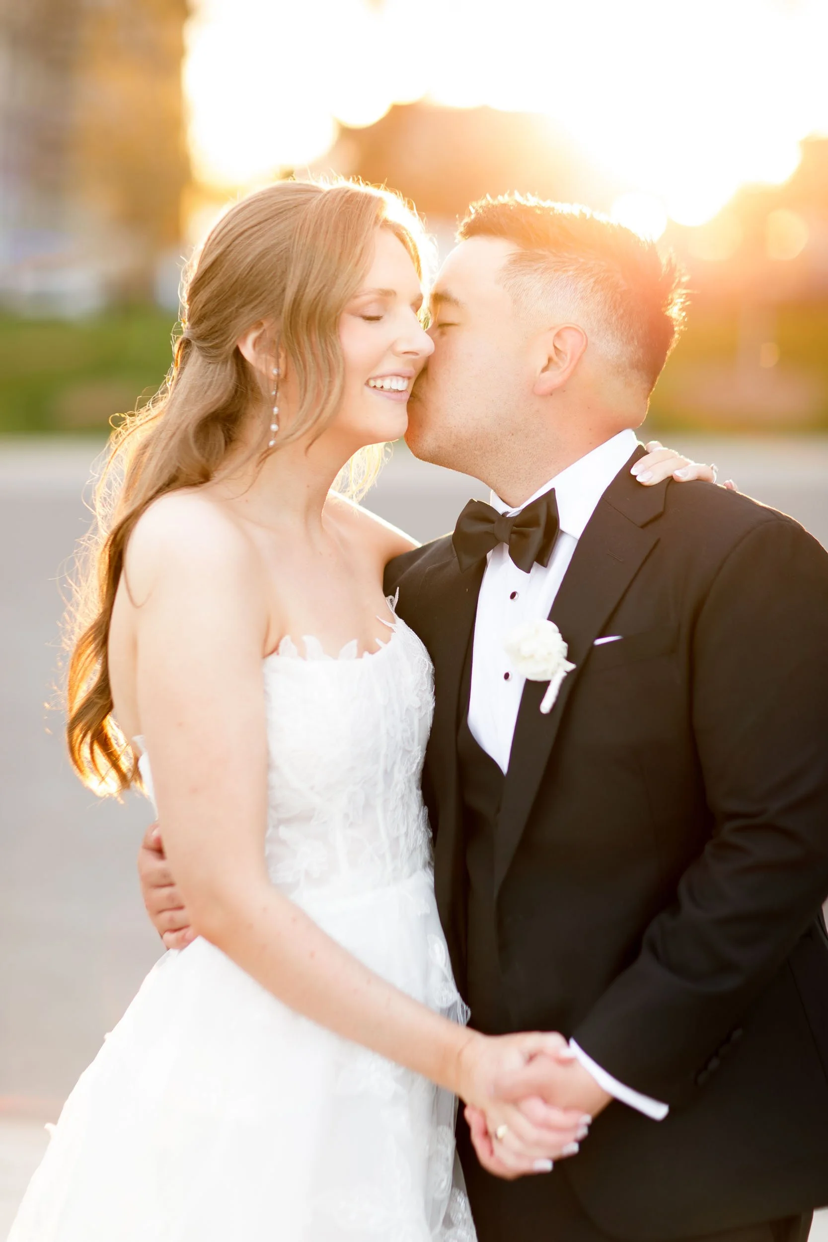 Bride and groom sharing a kiss at golden hour in Burlington Ontario