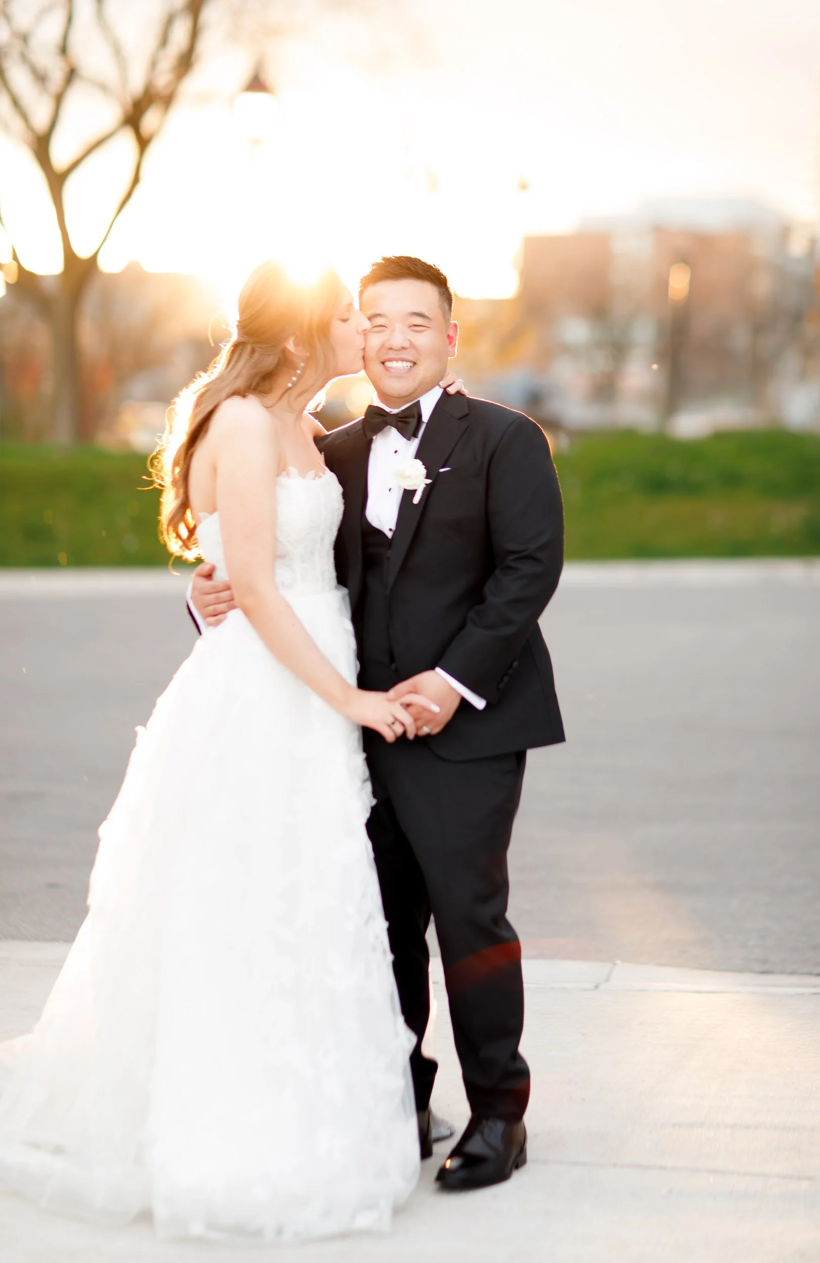 Bride and groom smiling together during sunset portraits in Burlington Ontario